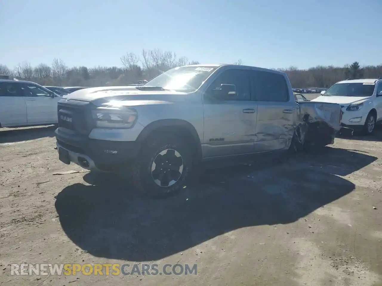 1 Photograph of a damaged car 1C6SRFLT0MN579062 RAM 1500 2021