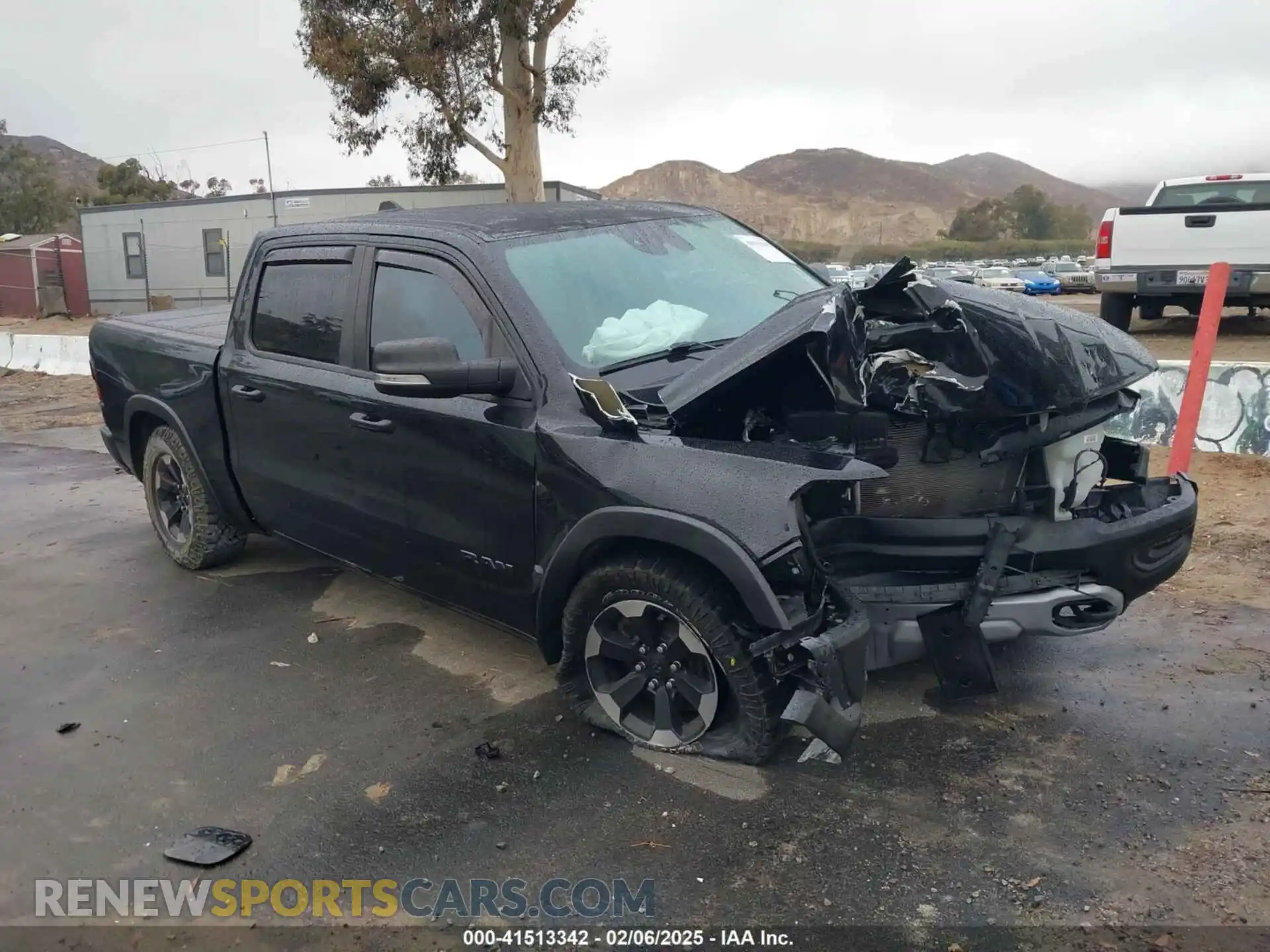 1 Photograph of a damaged car 1C6SRFLT0MN614070 RAM 1500 2021