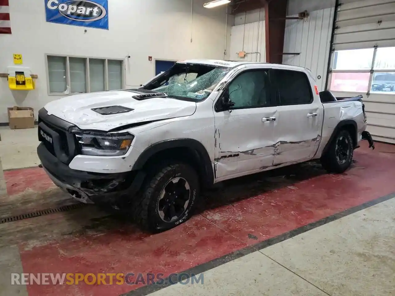 1 Photograph of a damaged car 1C6SRFLT2MN782406 RAM 1500 2021