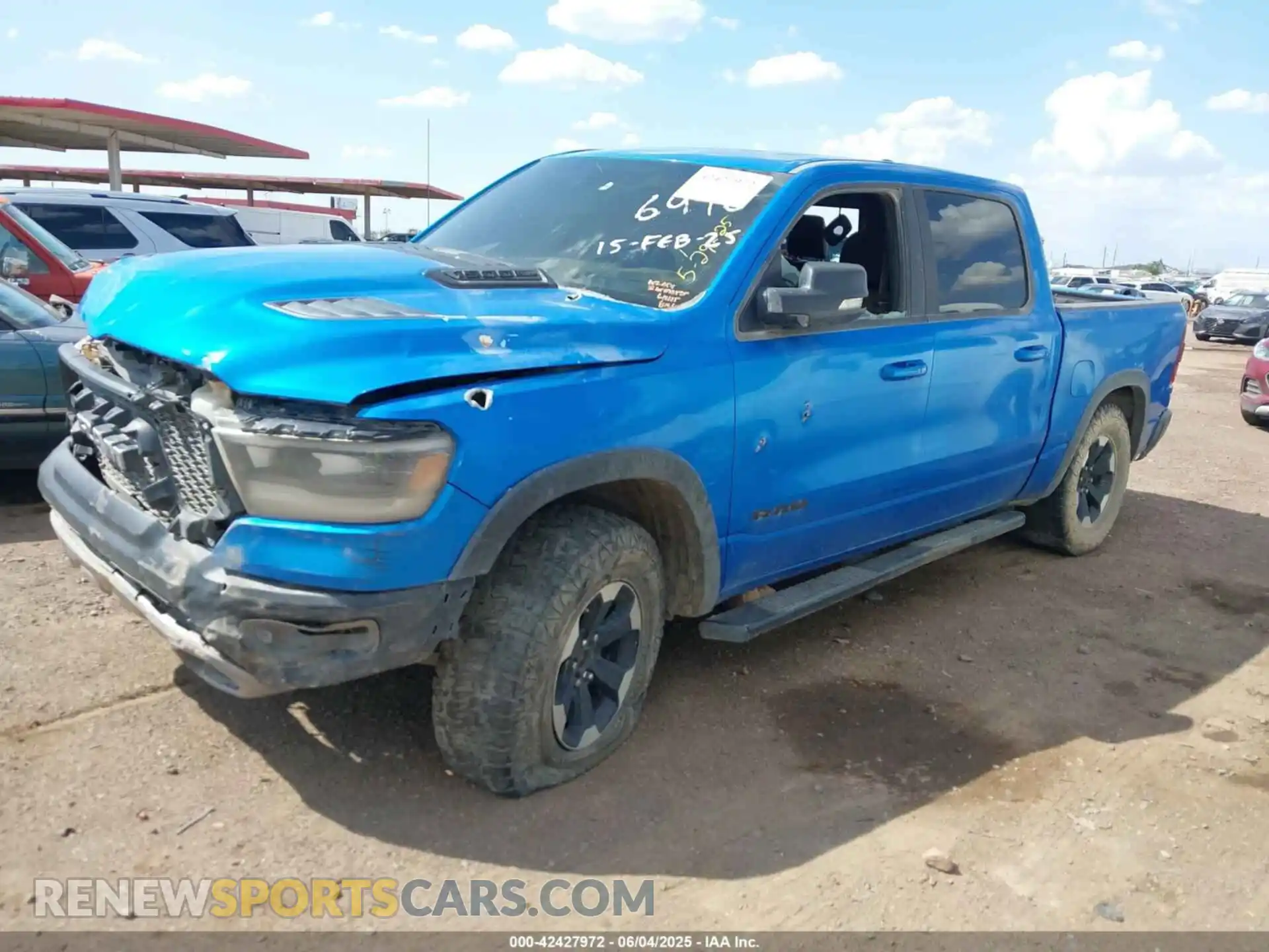2 Photograph of a damaged car 1C6SRFLT3MN573143 RAM 1500 2021