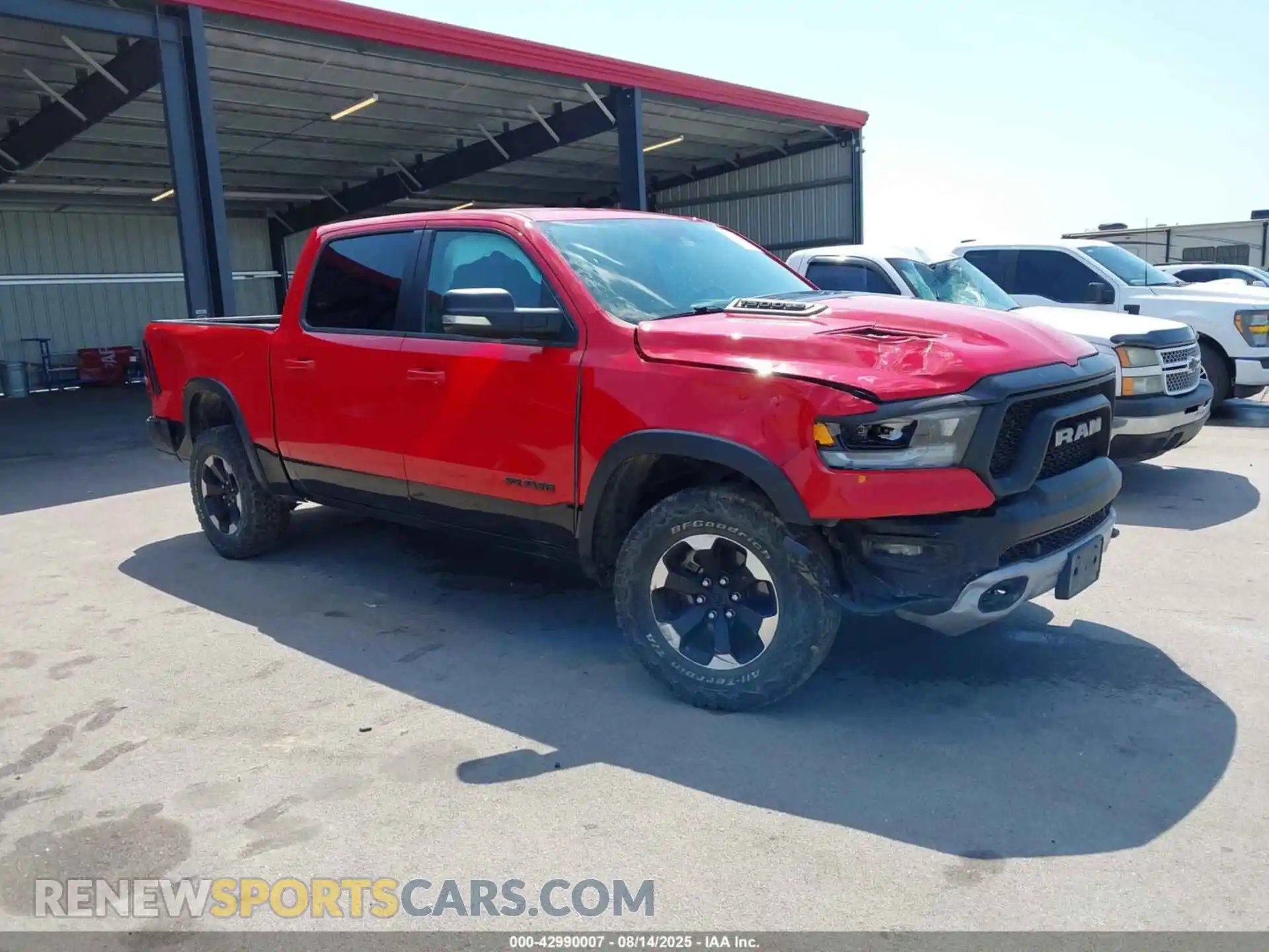 1 Photograph of a damaged car 1C6SRFLT4MN604657 RAM 1500 2021