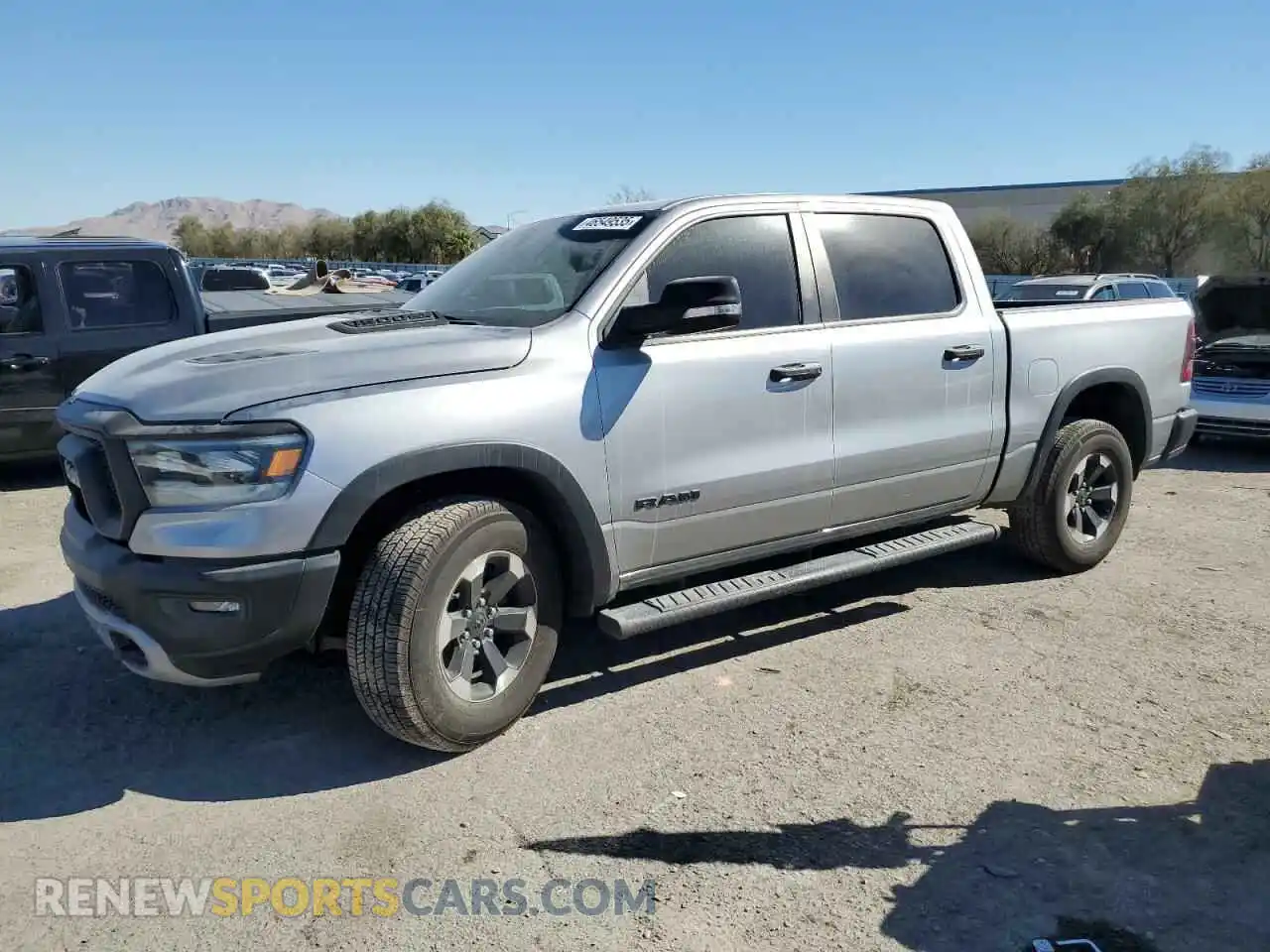 1 Photograph of a damaged car 1C6SRFLT6MN612677 RAM 1500 2021