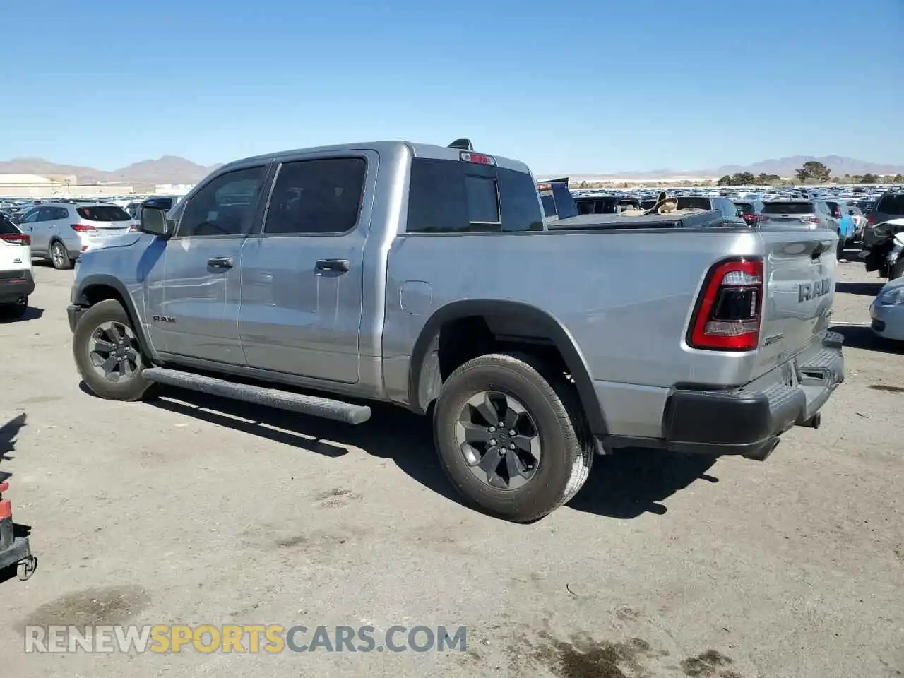 2 Photograph of a damaged car 1C6SRFLT6MN612677 RAM 1500 2021