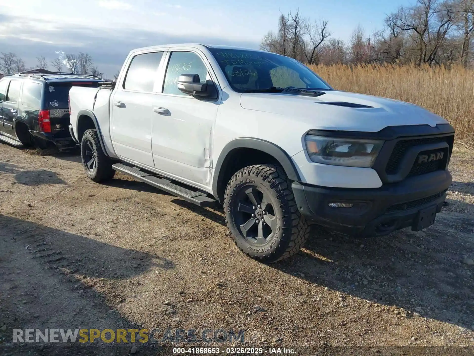 1 Photograph of a damaged car 1C6SRFLT7MN646031 RAM 1500 2021