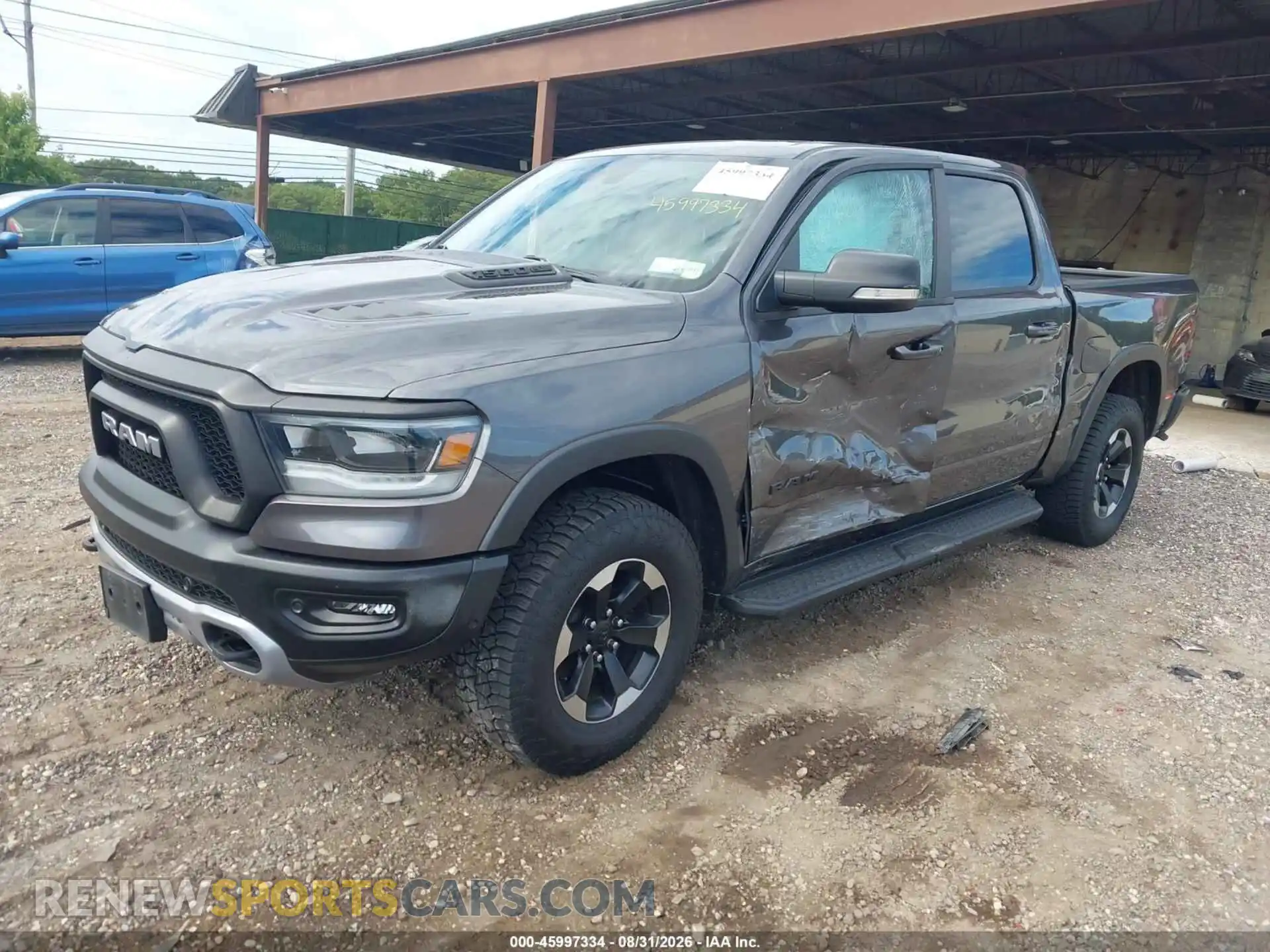2 Photograph of a damaged car 1C6SRFLT8MN559304 RAM 1500 2021
