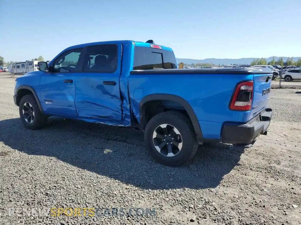 2 Photograph of a damaged car 1C6SRFLT8MN598457 RAM 1500 2021