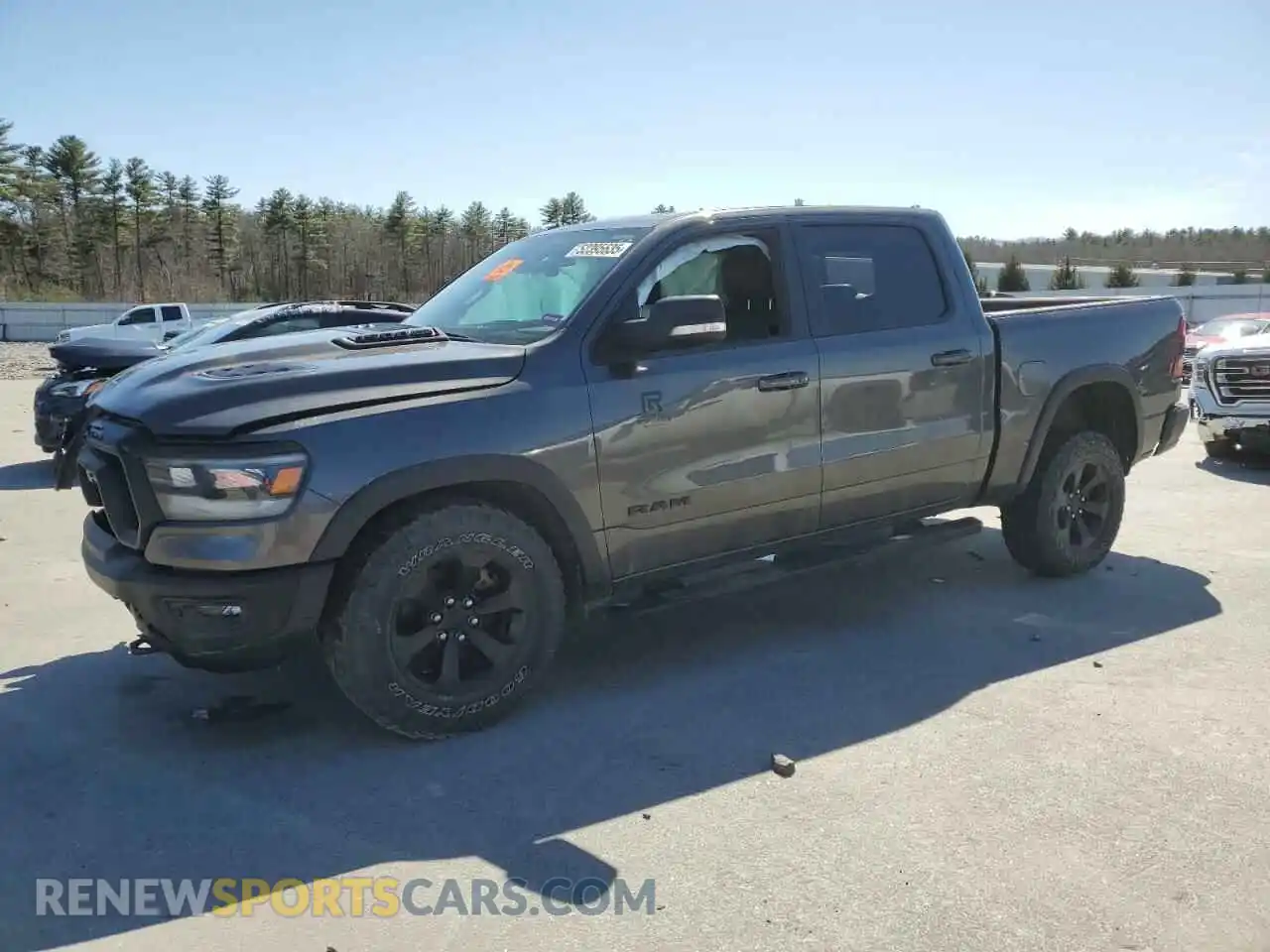 1 Photograph of a damaged car 1C6SRFLTXMN646198 RAM 1500 2021