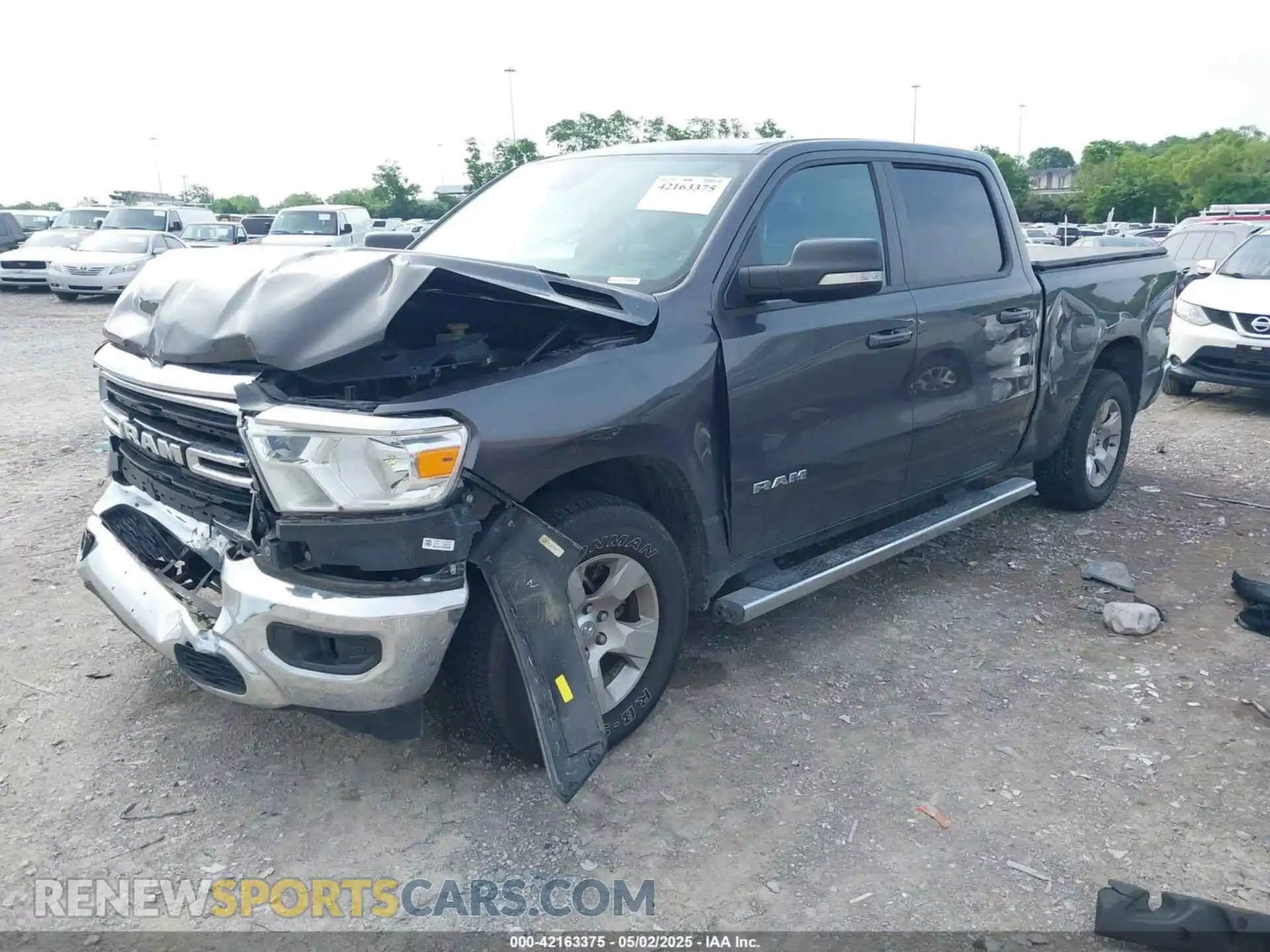 2 Photograph of a damaged car 1C6SRFMT0MN672355 RAM 1500 2021
