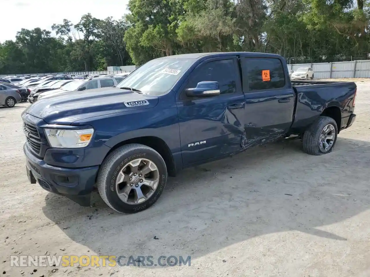 1 Photograph of a damaged car 1C6SRFMT0MN725619 RAM 1500 2021
