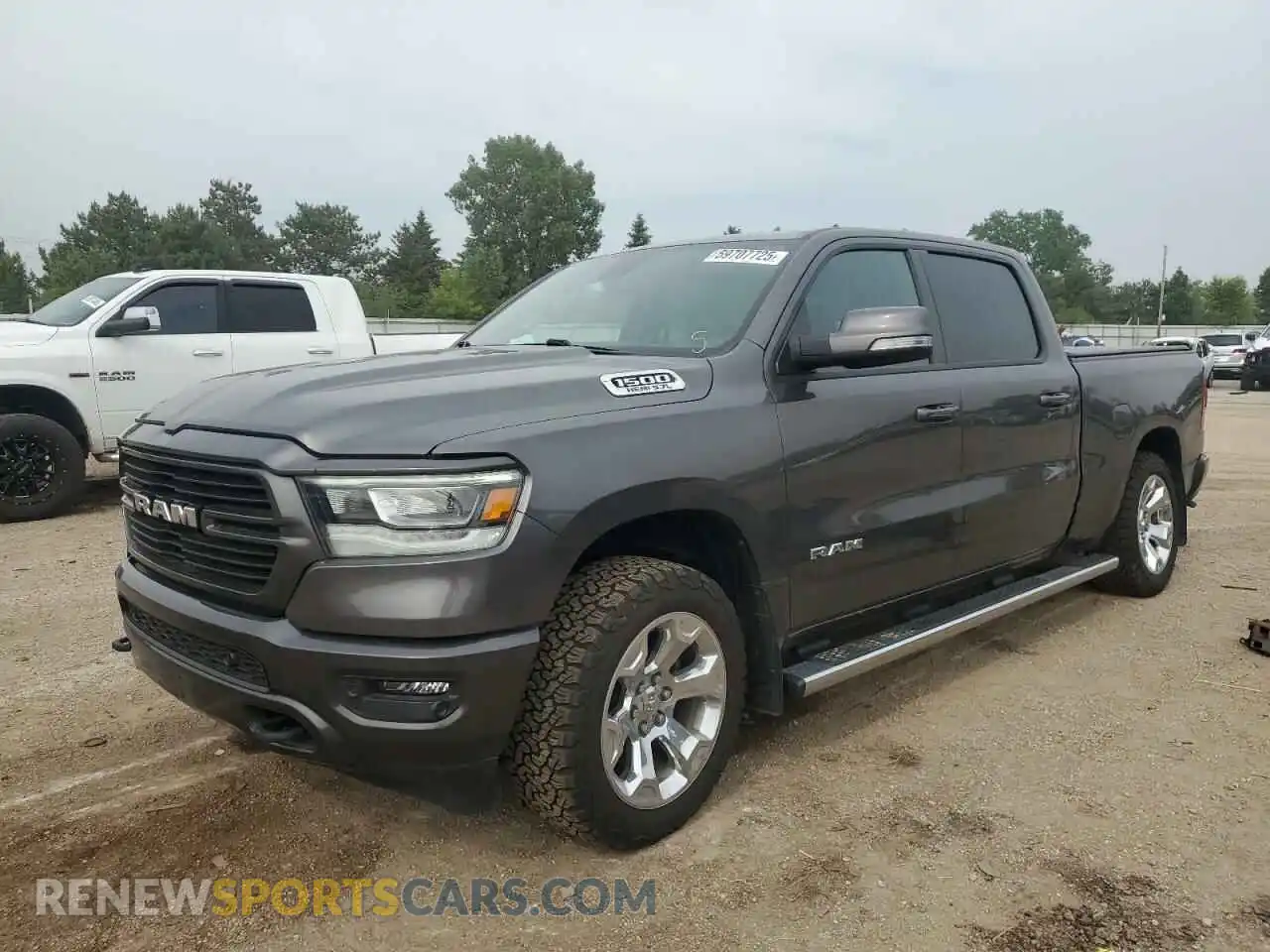 1 Photograph of a damaged car 1C6SRFMT4MN620954 RAM 1500 2021