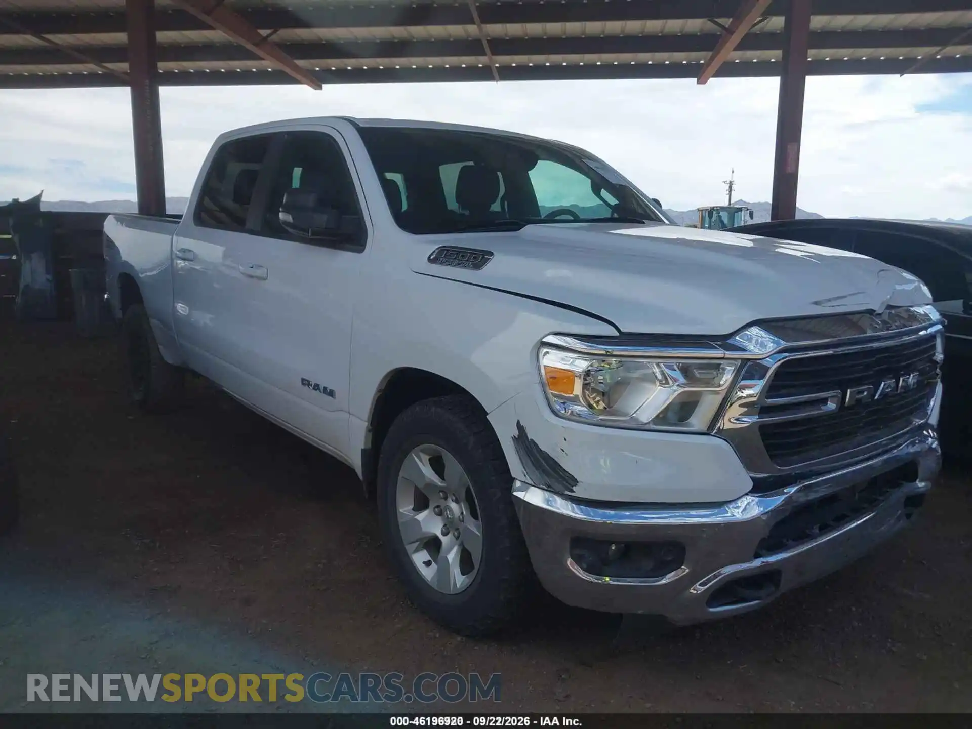 1 Photograph of a damaged car 1C6SRFMT6MN702068 RAM 1500 2021