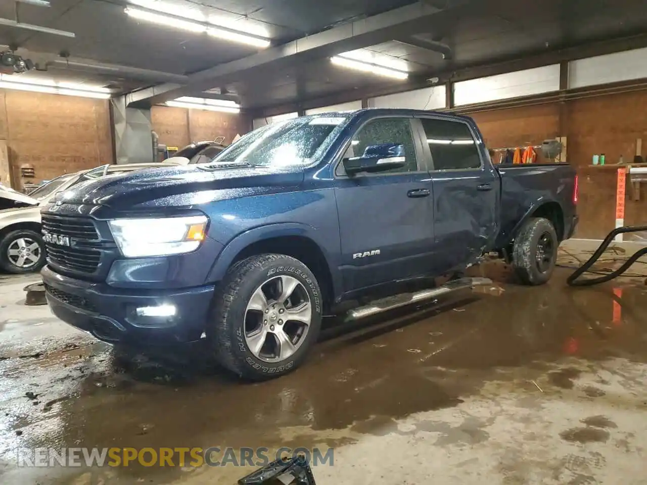 1 Photograph of a damaged car 1C6SRFRT2MN699534 RAM 1500 2021