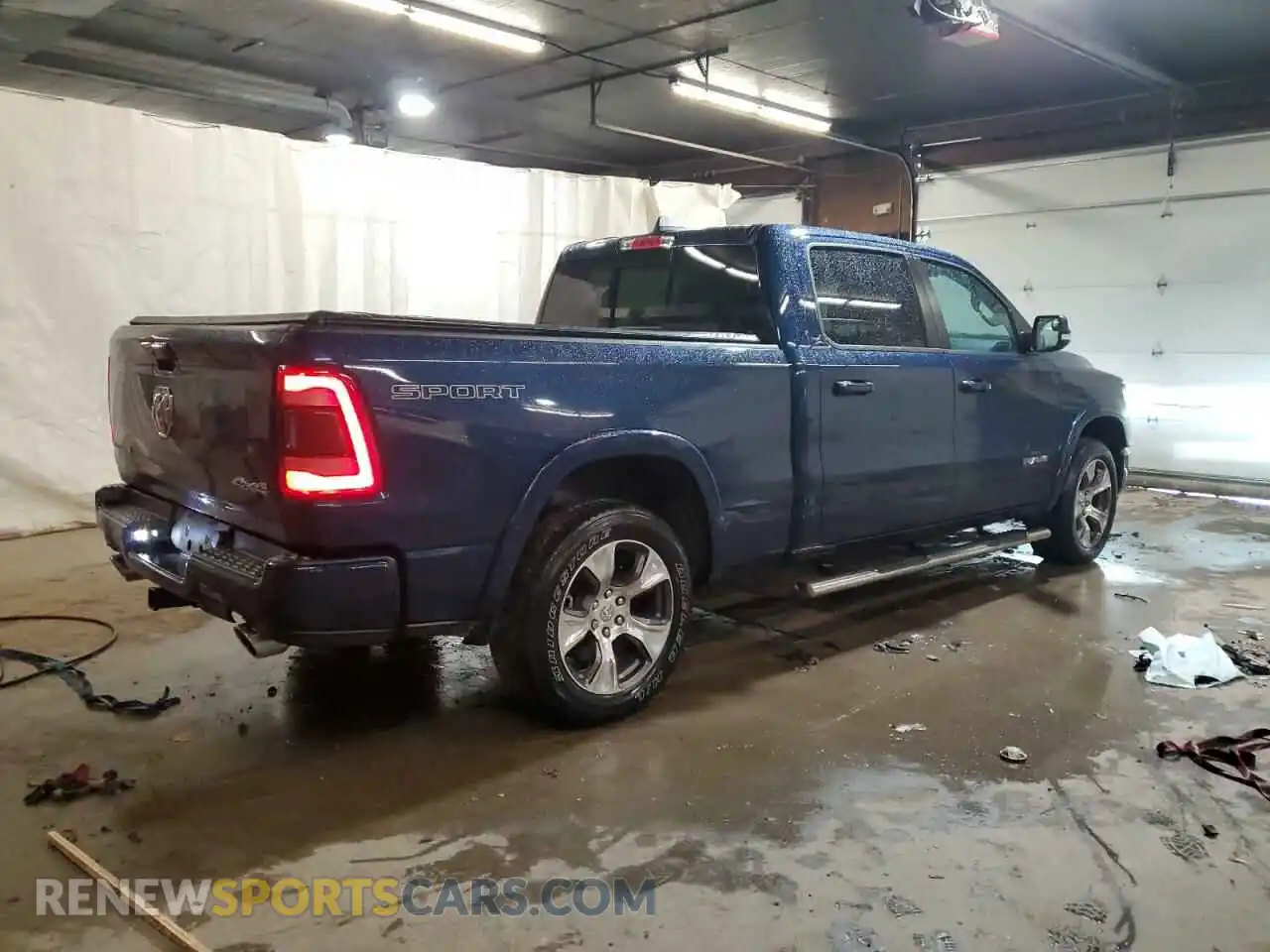 3 Photograph of a damaged car 1C6SRFRT2MN699534 RAM 1500 2021