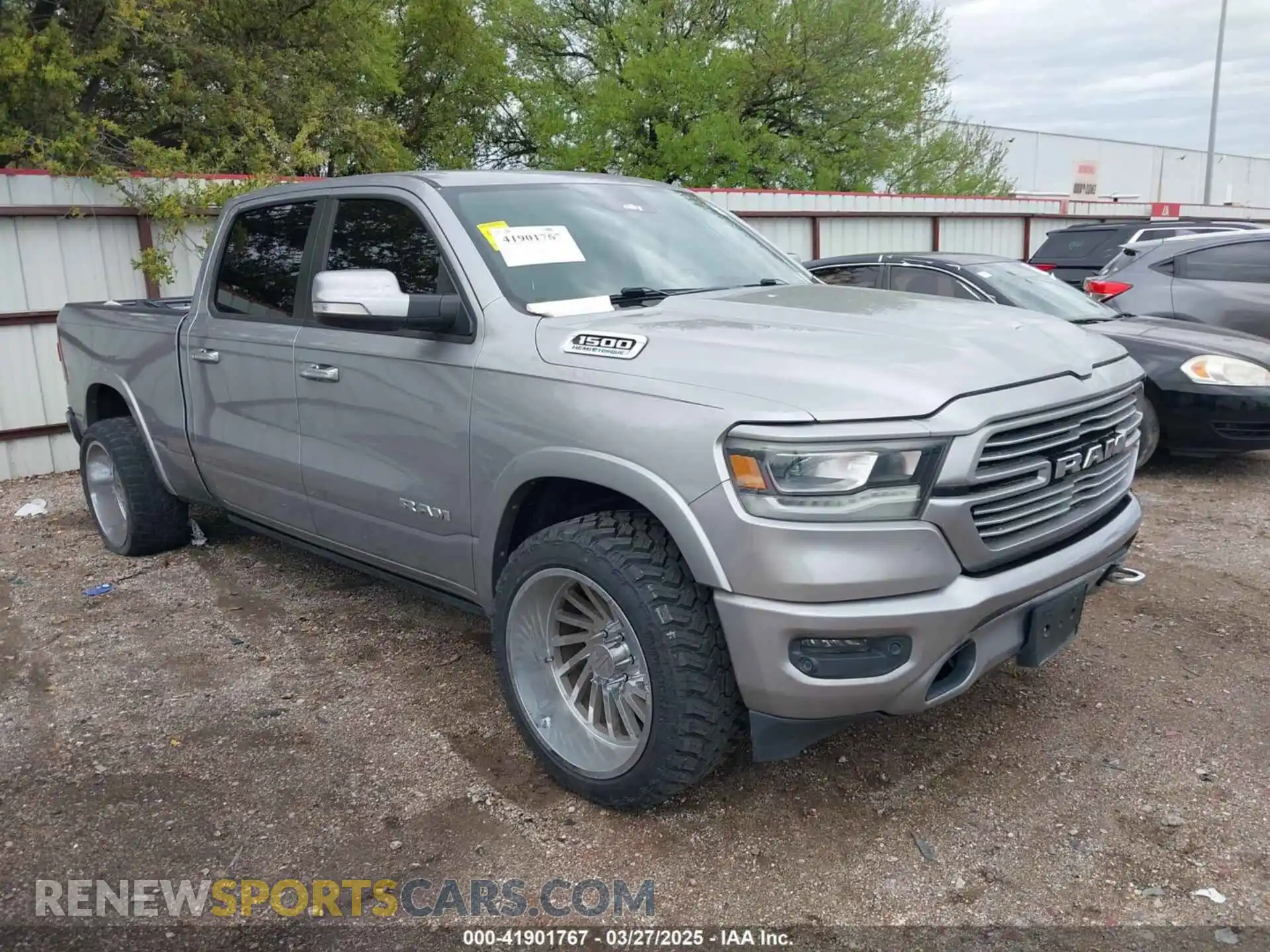 1 Photograph of a damaged car 1C6SRFRT3MN831765 RAM 1500 2021