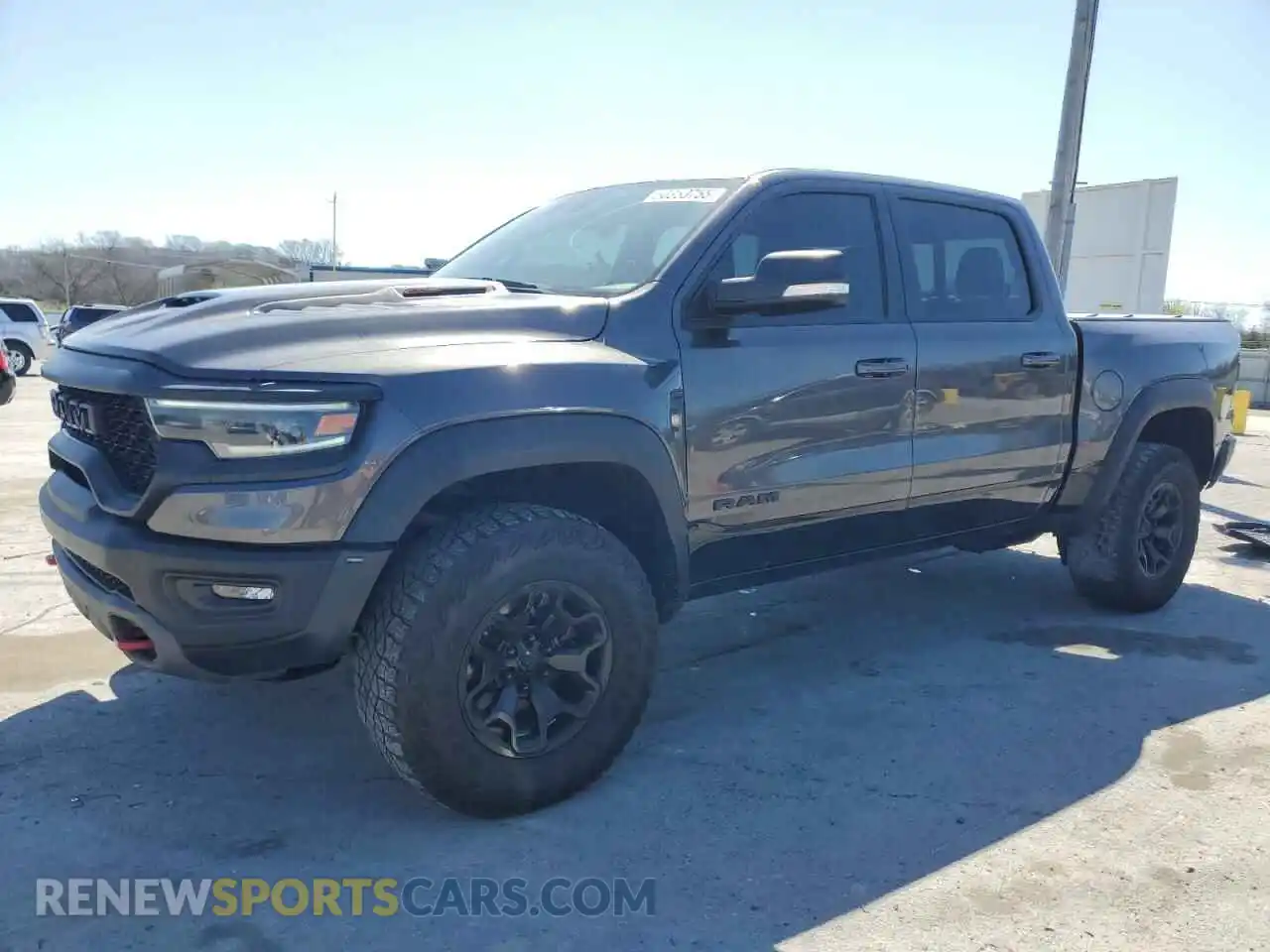 1 Photograph of a damaged car 1C6SRFU90MN832366 RAM 1500 2021