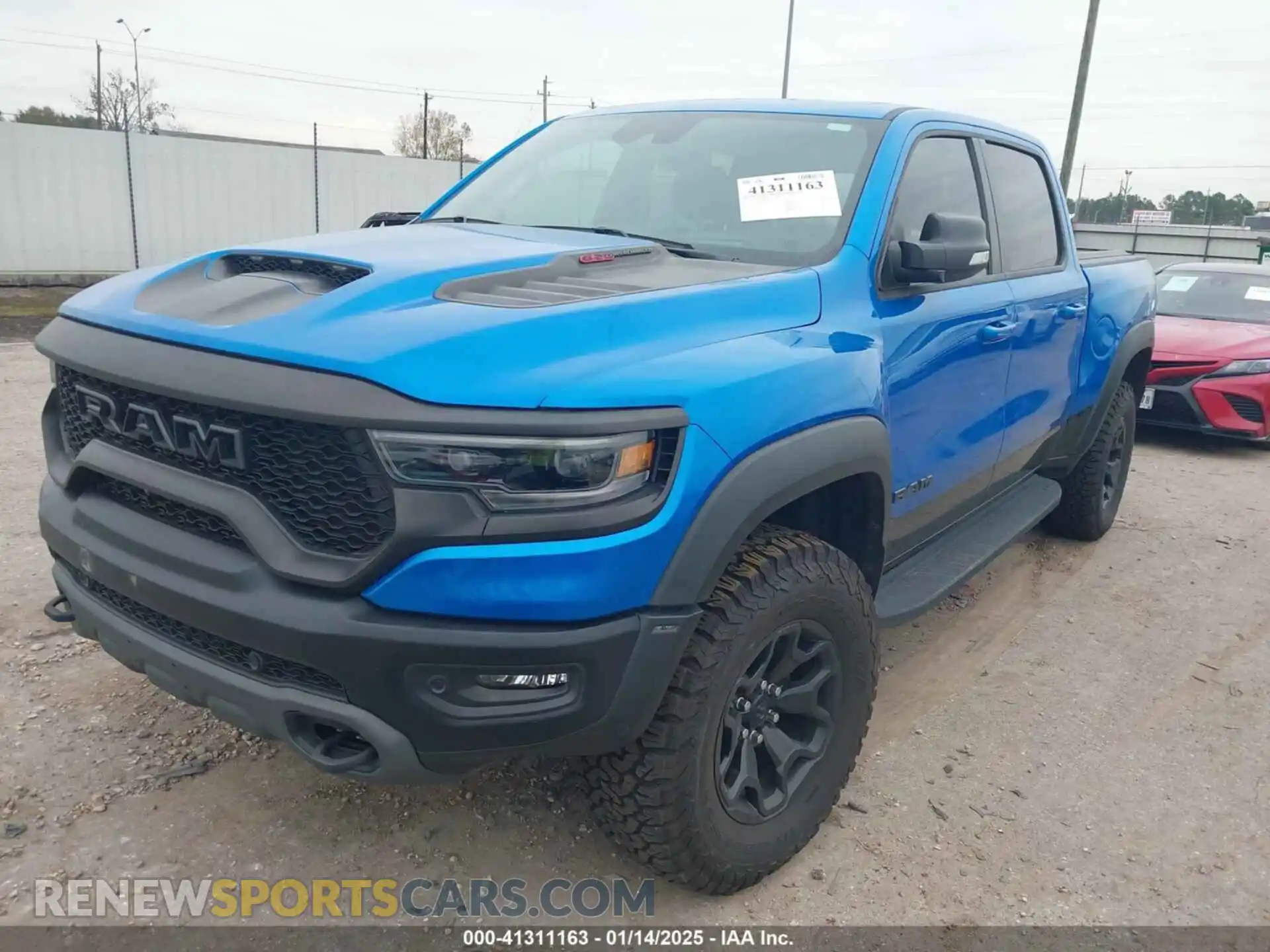 2 Photograph of a damaged car 1C6SRFU91MN685295 RAM 1500 2021