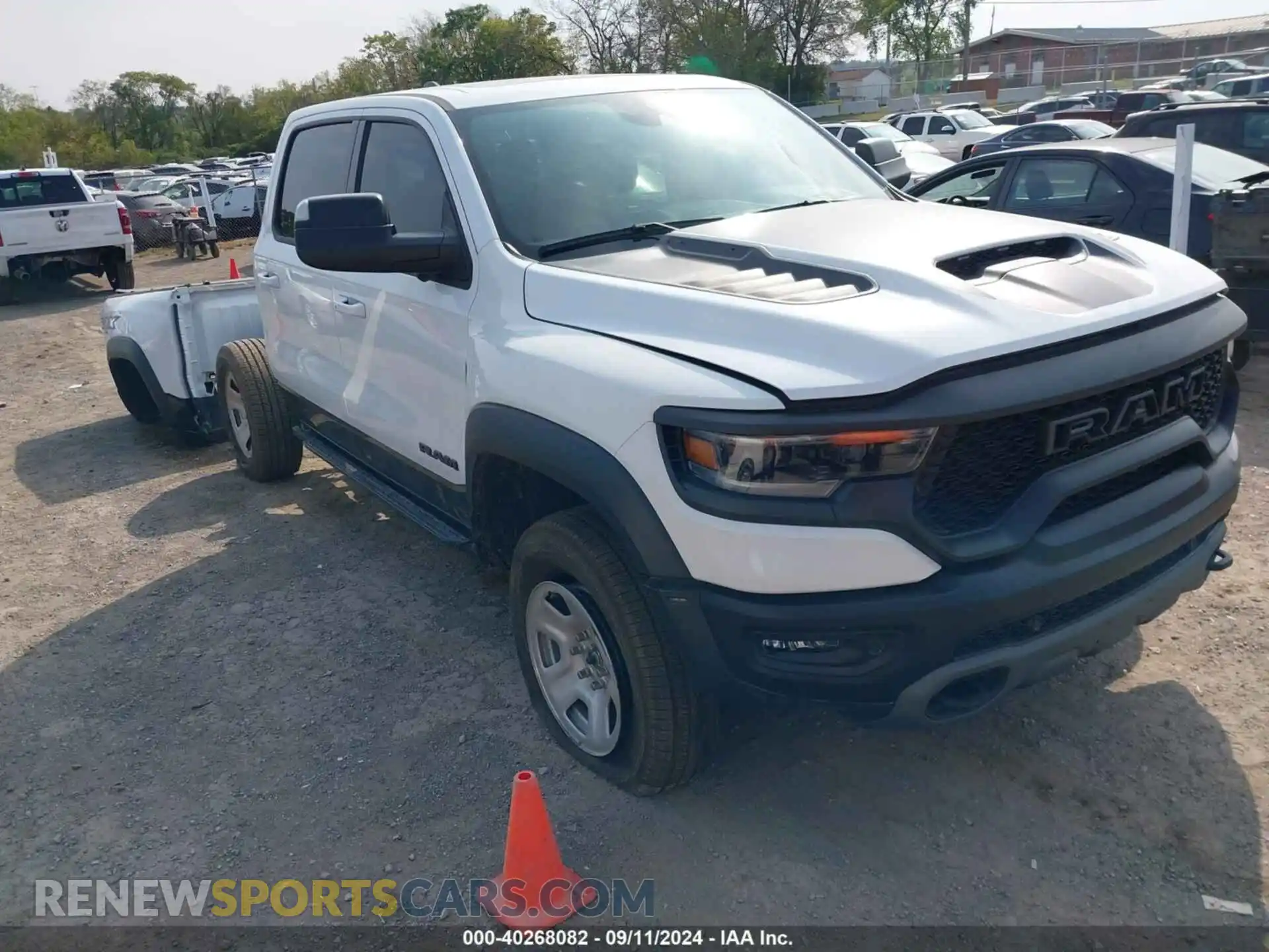 1 Photograph of a damaged car 1C6SRFU93MN699456 RAM 1500 2021