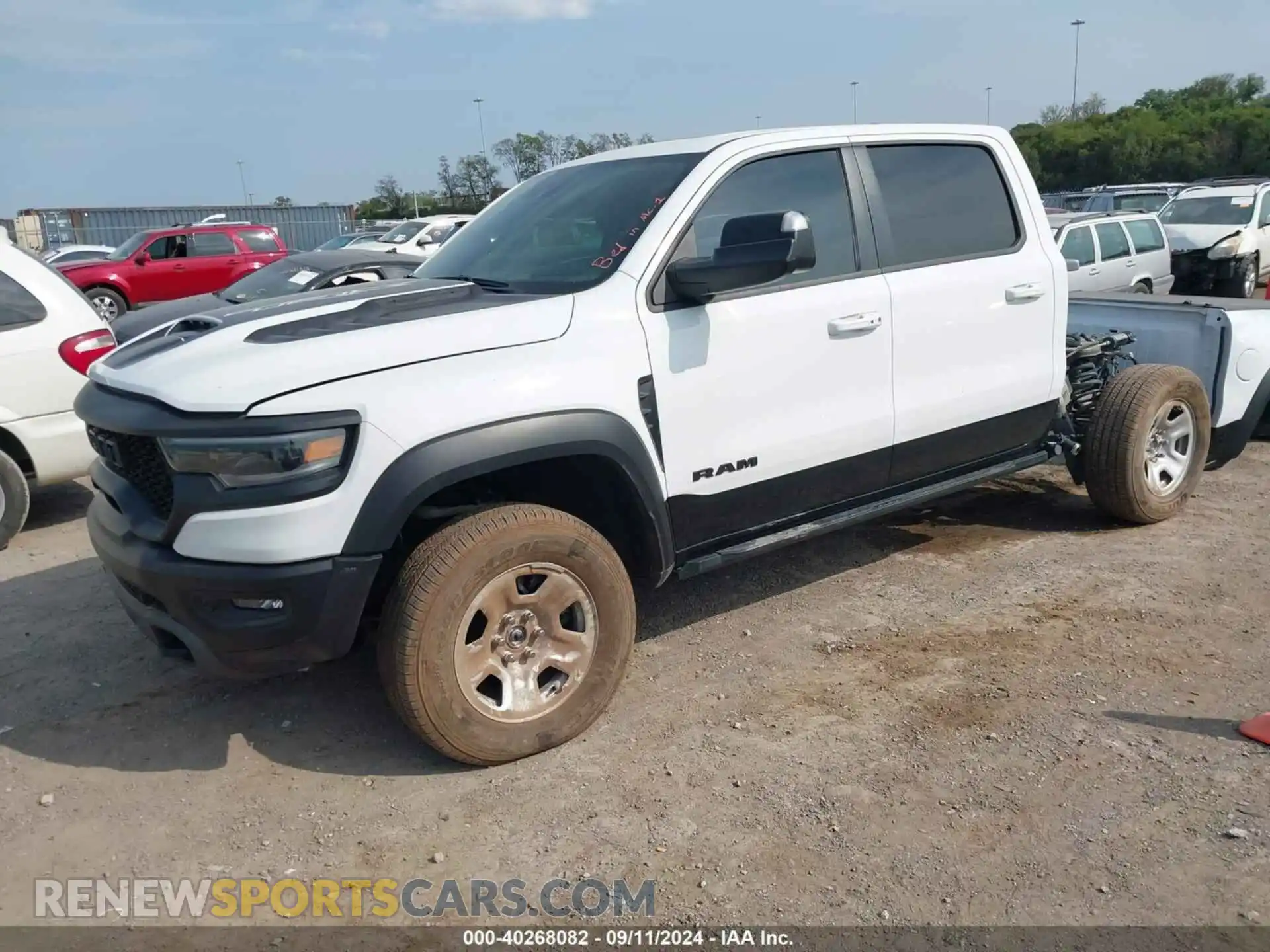 2 Photograph of a damaged car 1C6SRFU93MN699456 RAM 1500 2021