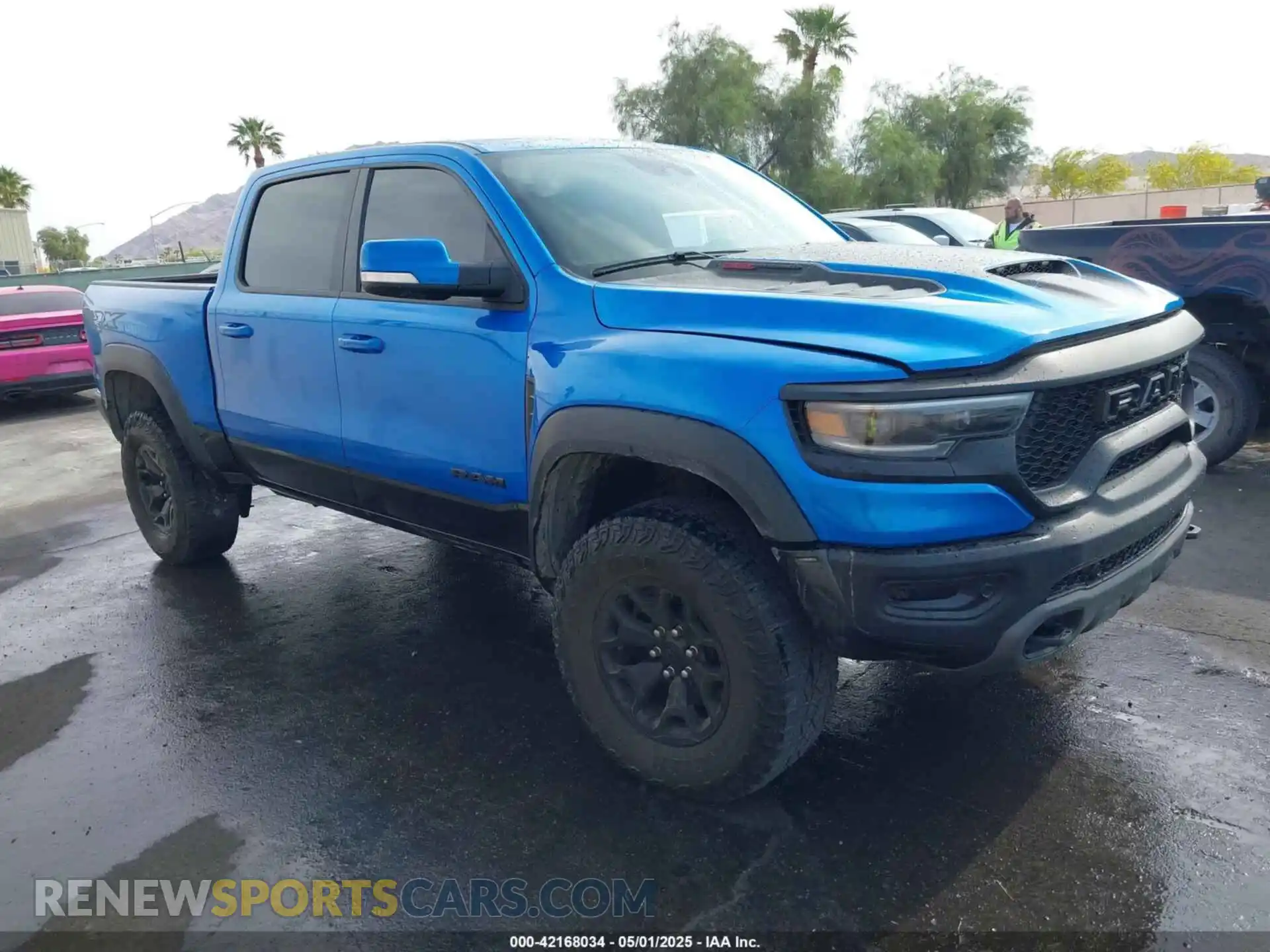 1 Photograph of a damaged car 1C6SRFU94MN705006 RAM 1500 2021