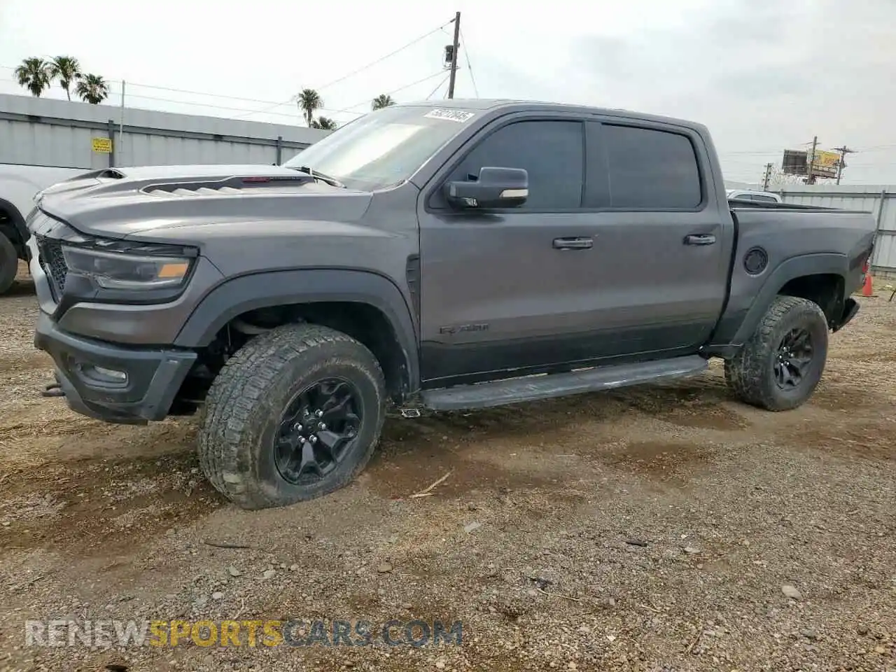 1 Photograph of a damaged car 1C6SRFU94MN767411 RAM 1500 2021