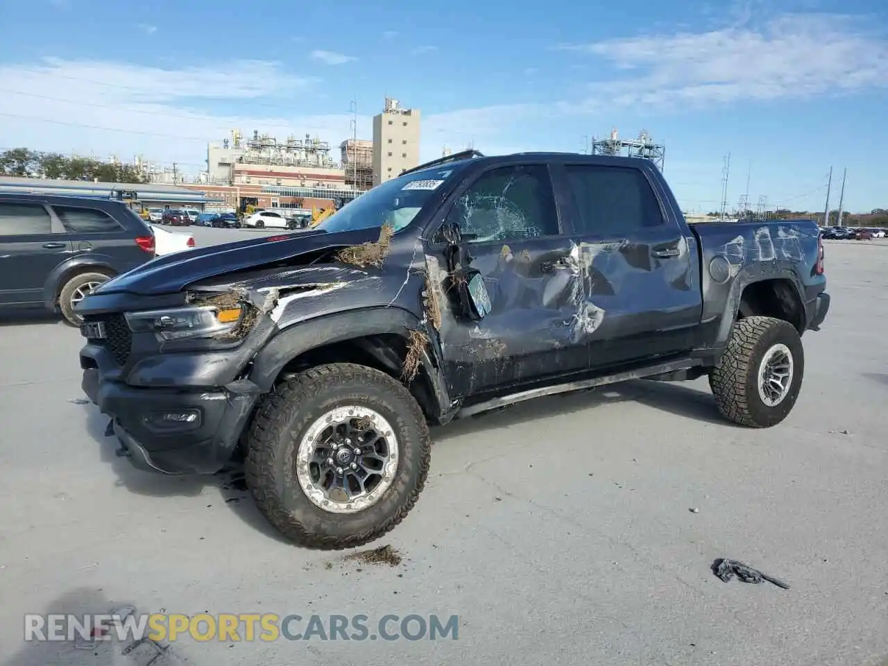 1 Photograph of a damaged car 1C6SRFU94MN829552 RAM 1500 2021