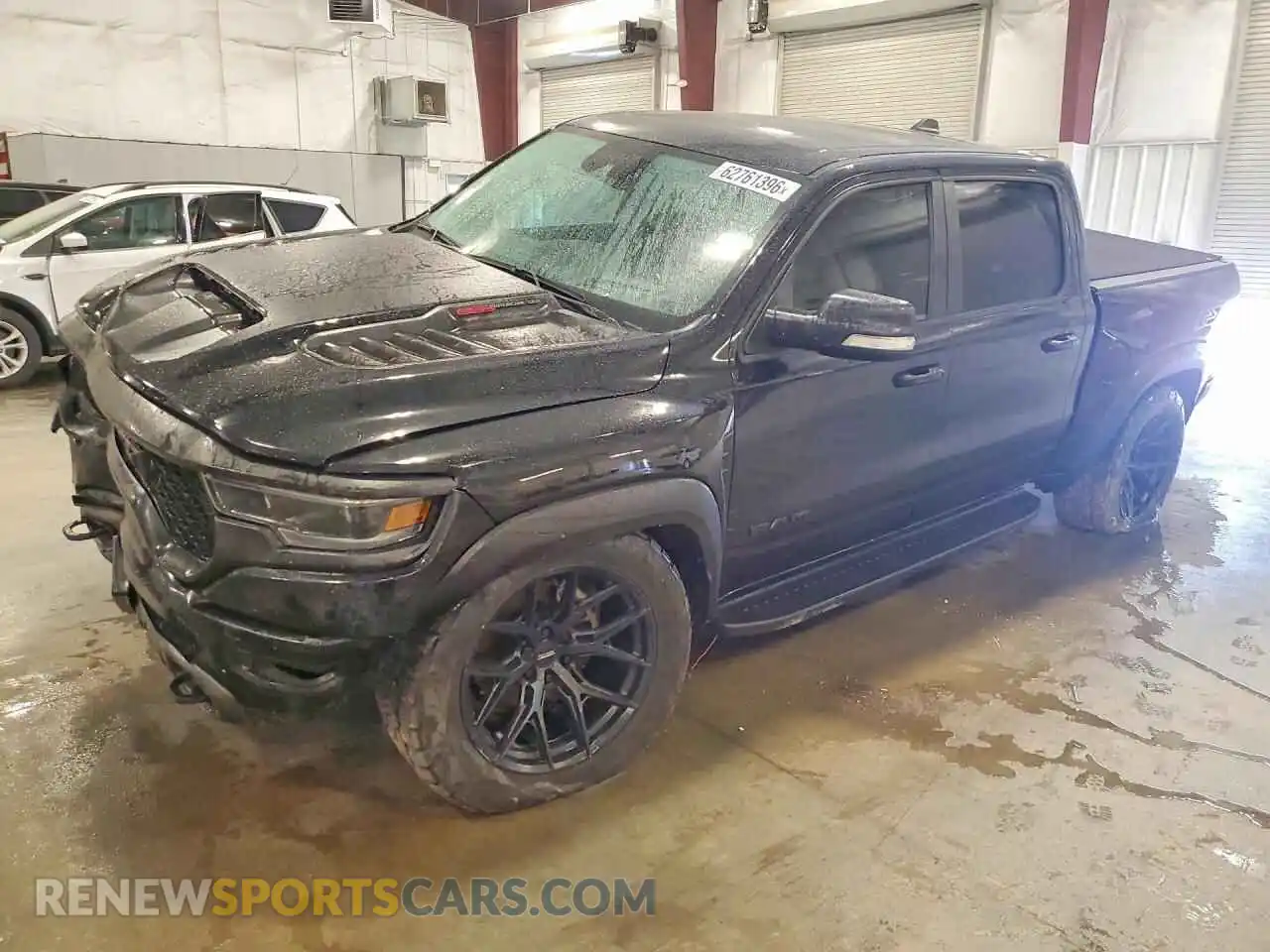 1 Photograph of a damaged car 1C6SRFU95MN904128 RAM 1500 2021