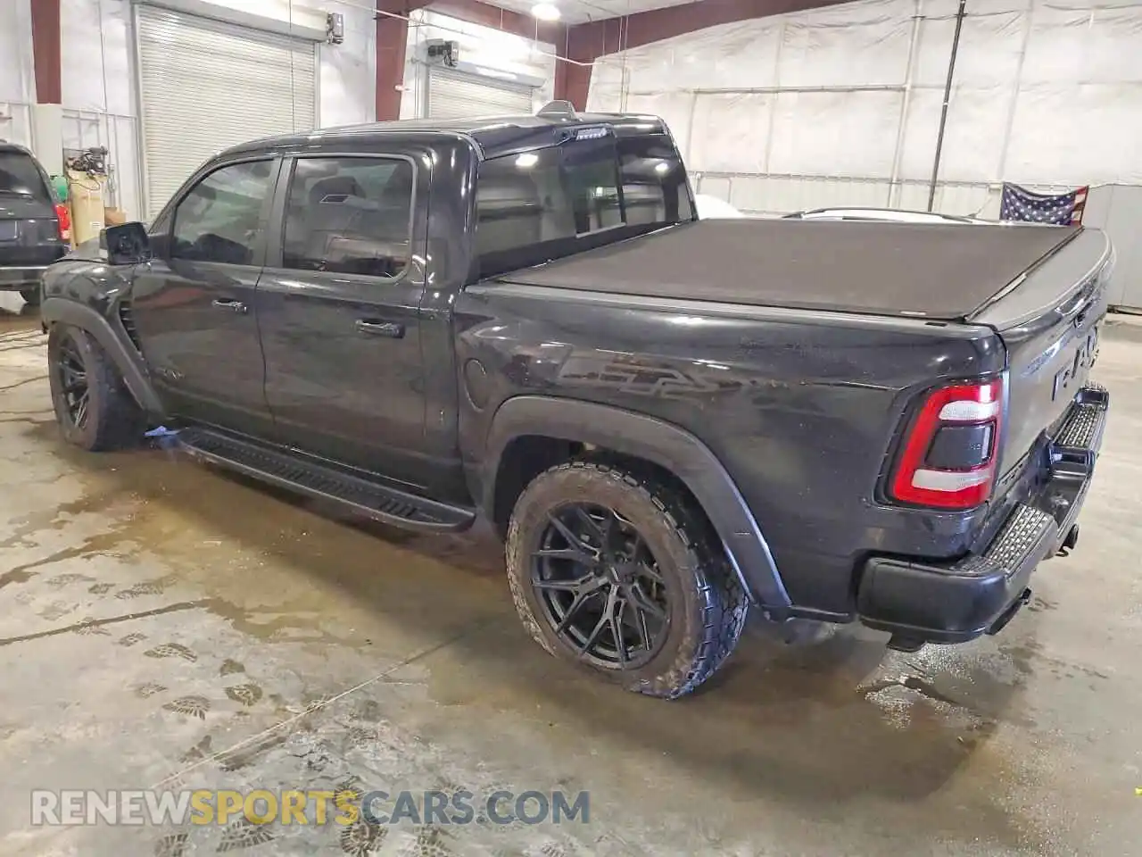 2 Photograph of a damaged car 1C6SRFU95MN904128 RAM 1500 2021