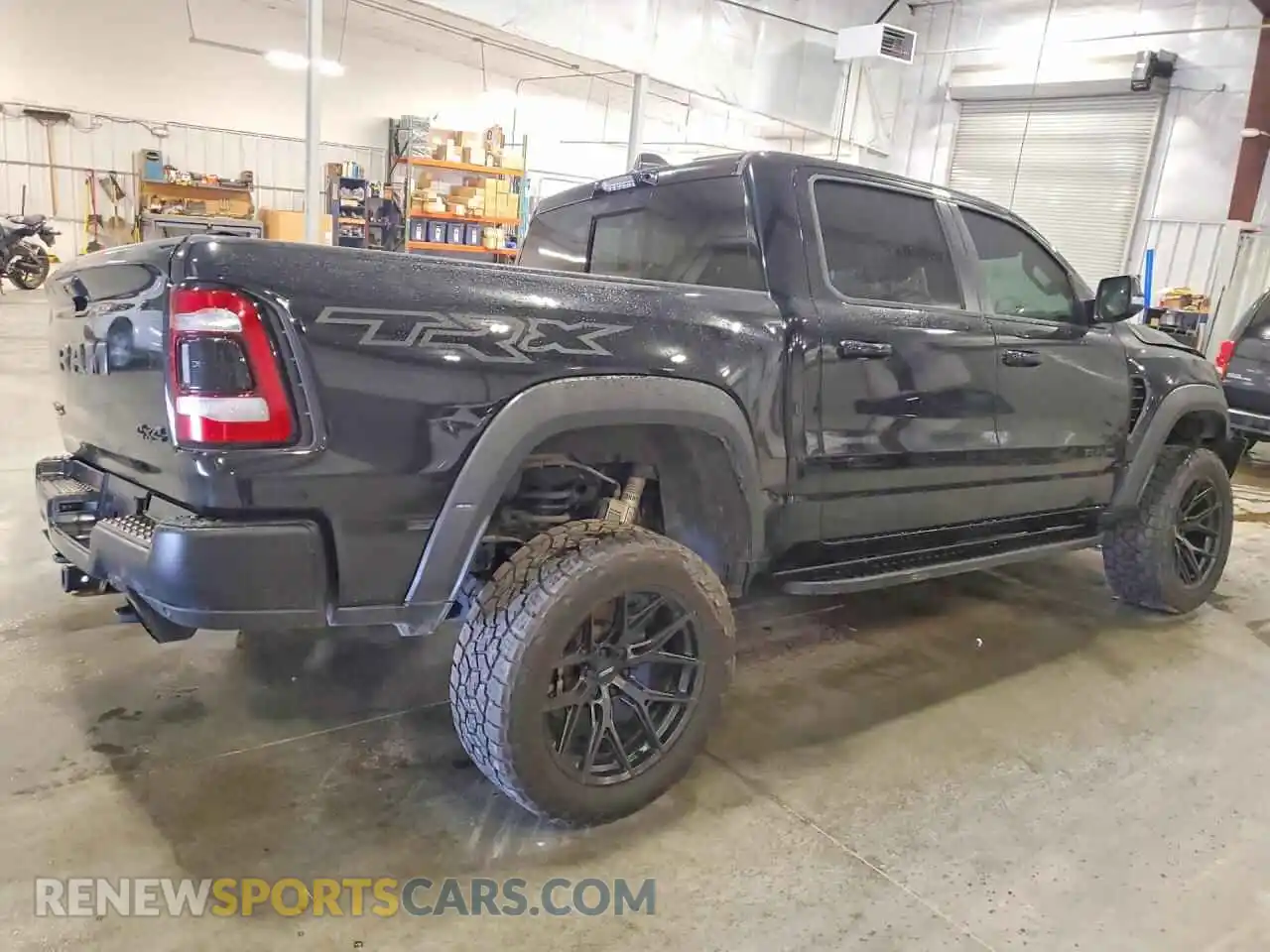 3 Photograph of a damaged car 1C6SRFU95MN904128 RAM 1500 2021