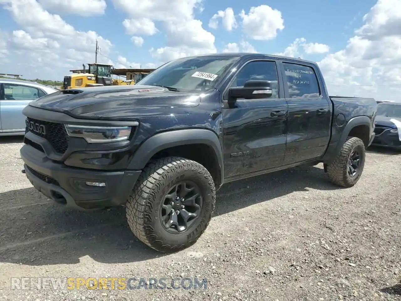 1 Photograph of a damaged car 1C6SRFU96MN685390 RAM 1500 2021