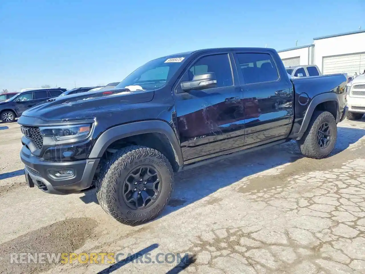 1 Photograph of a damaged car 1C6SRFU96MN781696 RAM 1500 2021