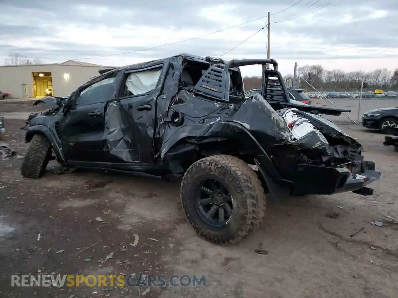 2 Photograph of a damaged car 1C6SRFU97MN826953 RAM 1500 2021
