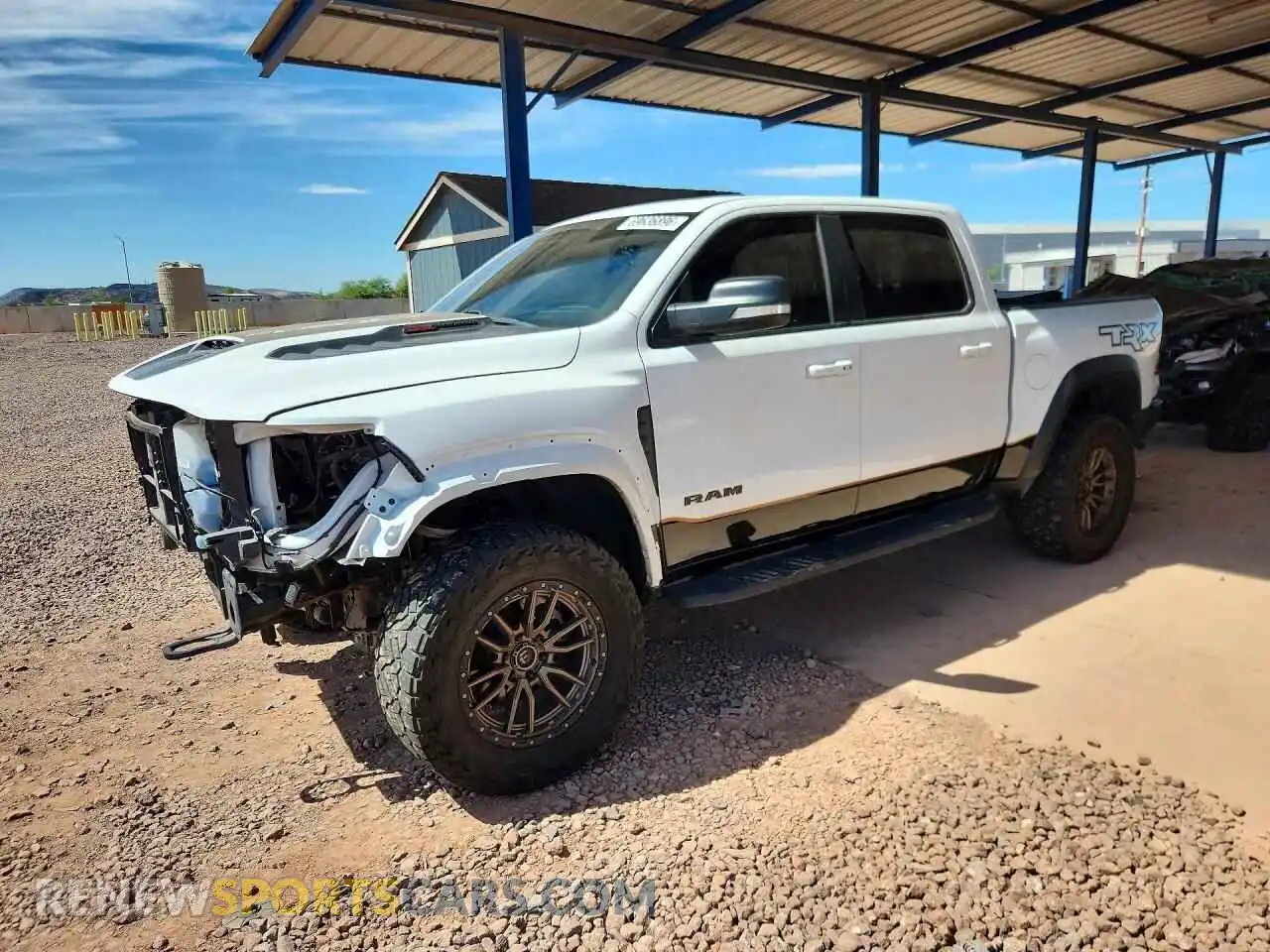 1 Photograph of a damaged car 1C6SRFU98MN818327 RAM 1500 2021