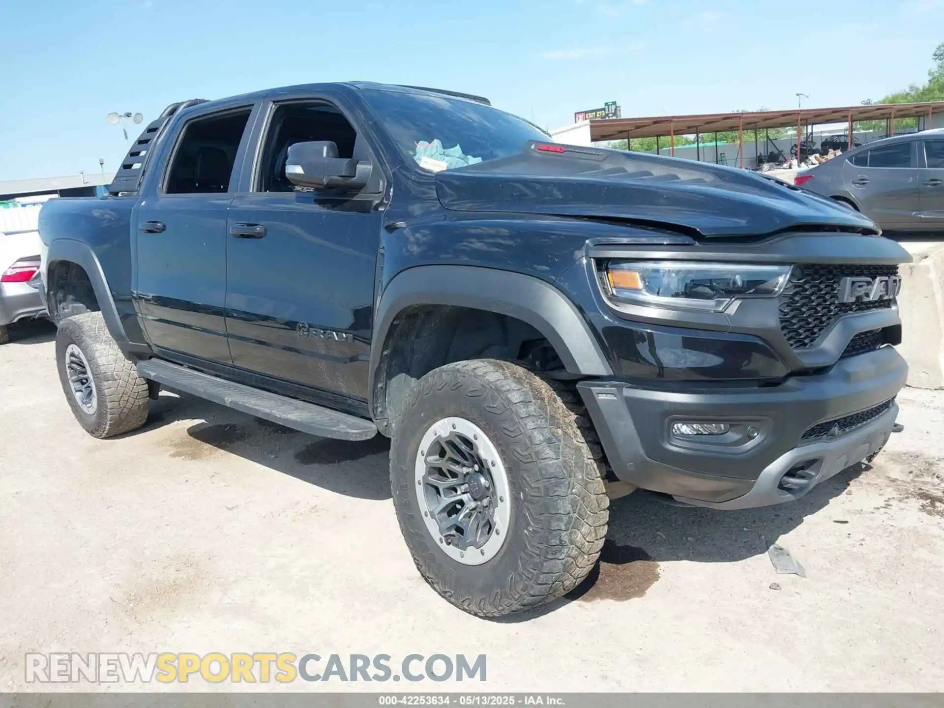 1 Photograph of a damaged car 1C6SRFU98MN902423 RAM 1500 2021