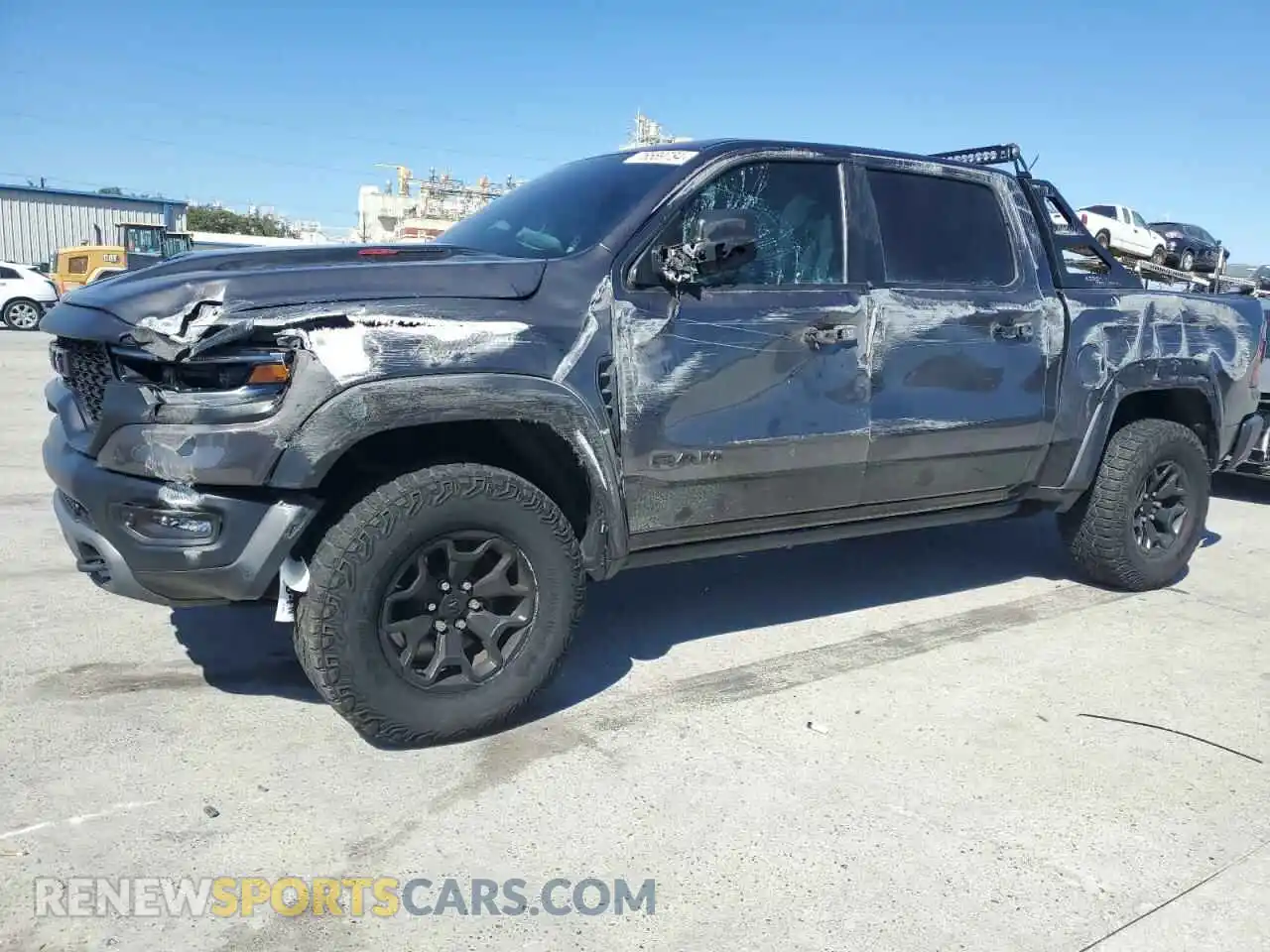 1 Photograph of a damaged car 1C6SRFU99MN744688 RAM 1500 2021
