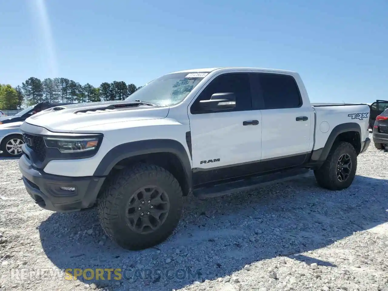 1 Photograph of a damaged car 1C6SRFU99MN756338 RAM 1500 2021