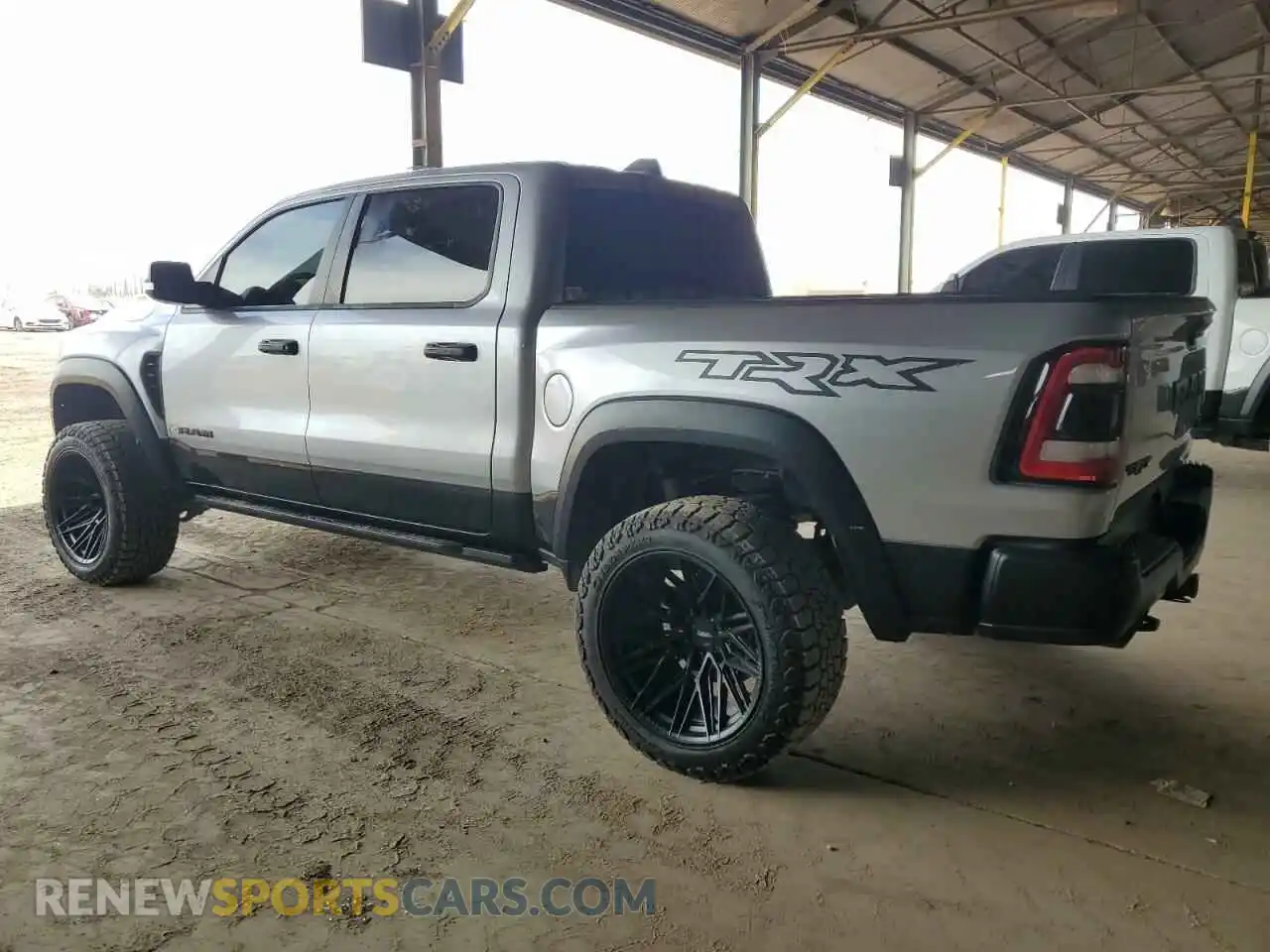 2 Photograph of a damaged car 1C6SRFU99MN905668 RAM 1500 2021