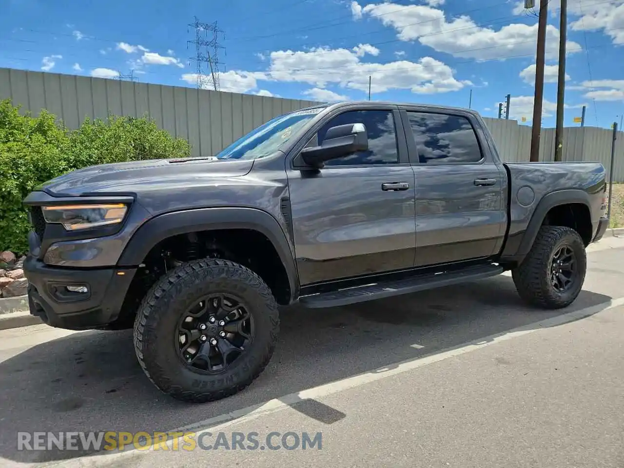 1 Photograph of a damaged car 1C6SRFU9XMN780096 RAM 1500 2021