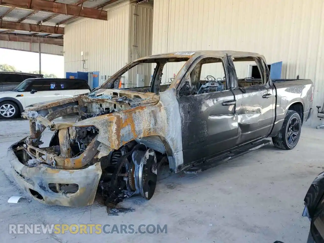 1 Photograph of a damaged car 1C6RREFG9NN398776 RAM 1500 2022