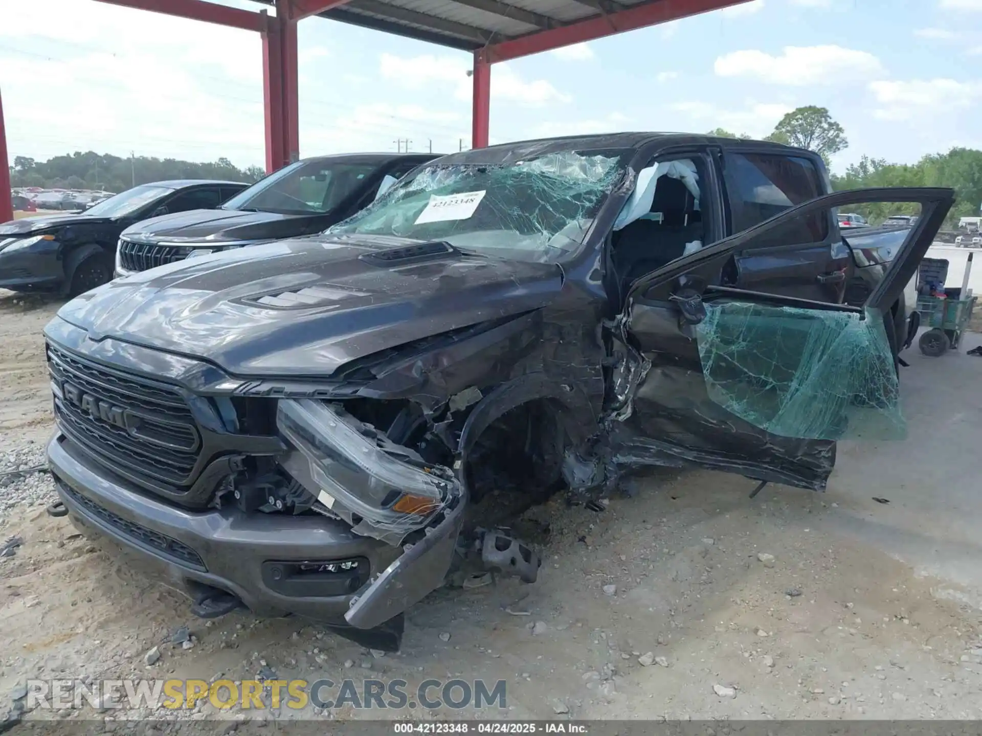 2 Photograph of a damaged car 1C6RREHT8NN187076 RAM 1500 2022