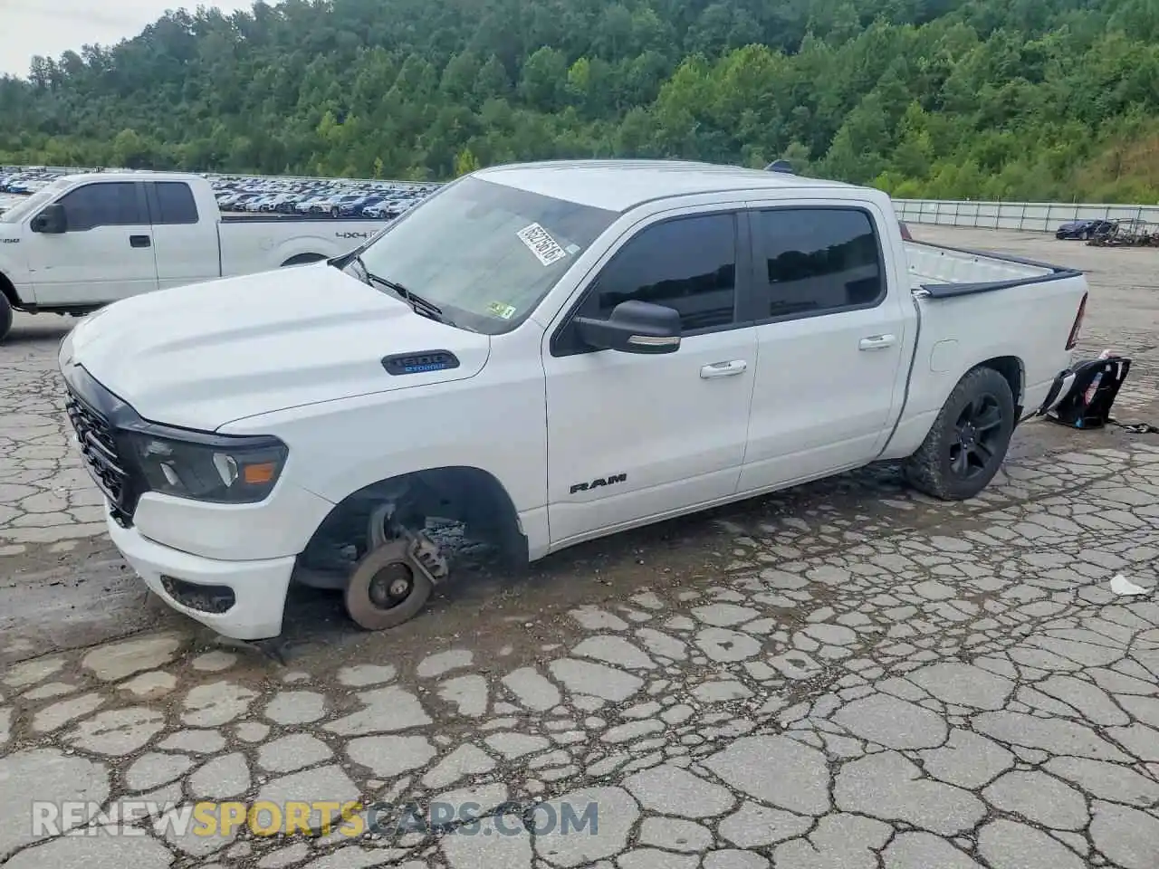 1 Photograph of a damaged car 1C6RRFFGXNN310730 RAM 1500 2022