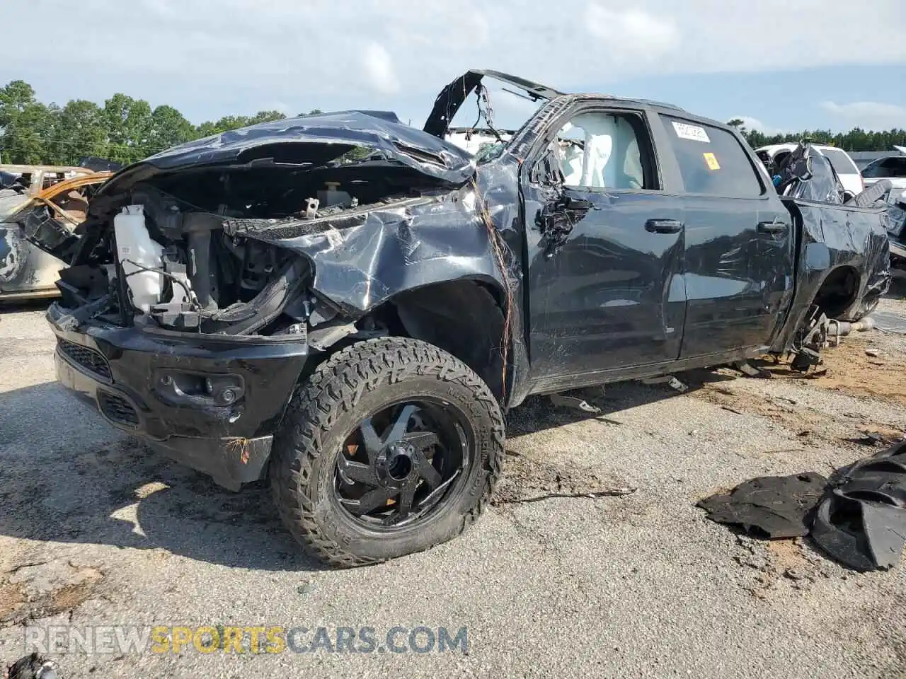 1 Photograph of a damaged car 1C6SRFFT2NN135713 RAM 1500 2022