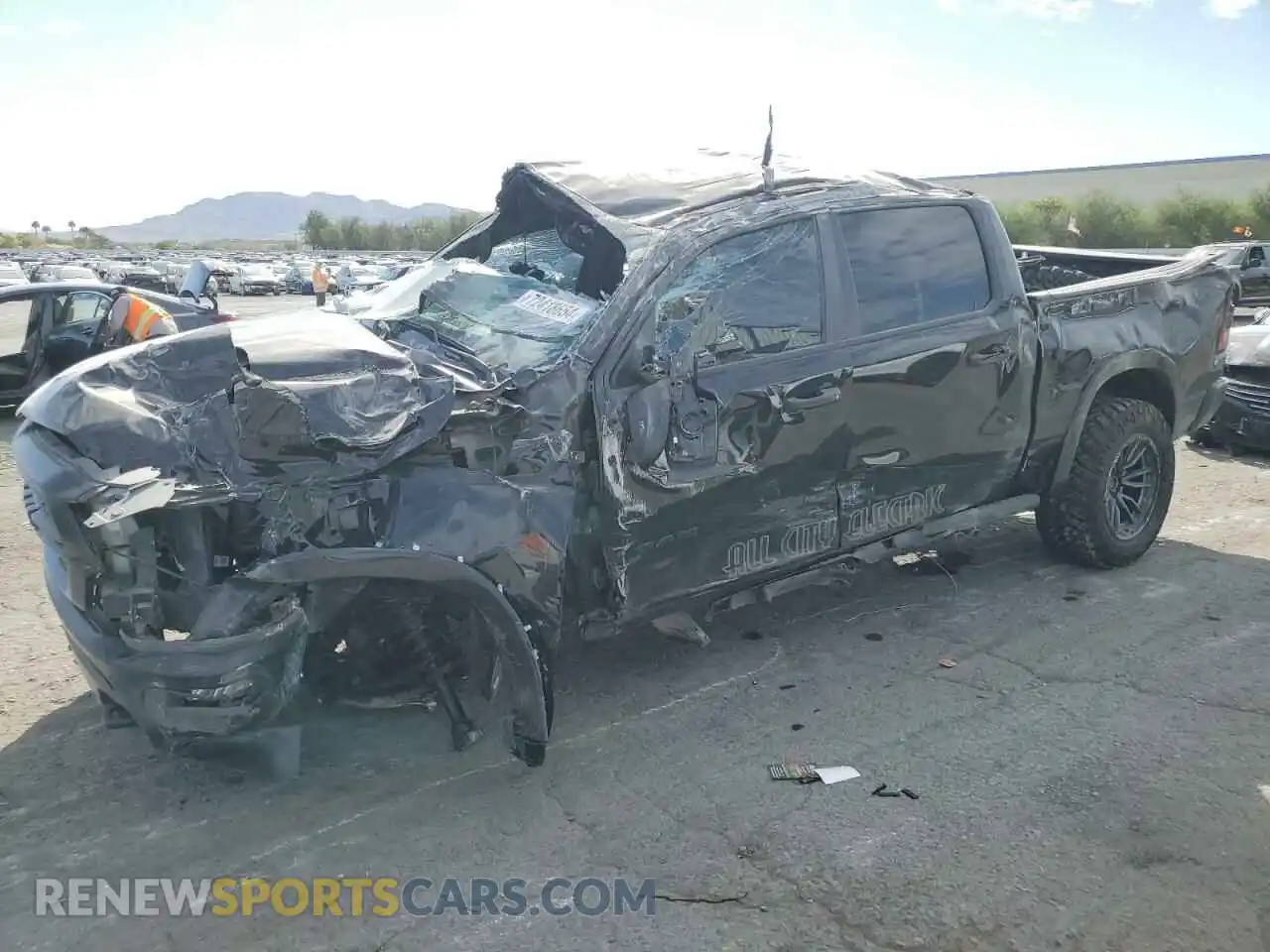 1 Photograph of a damaged car 1C6SRFFT3NN251096 RAM 1500 2022