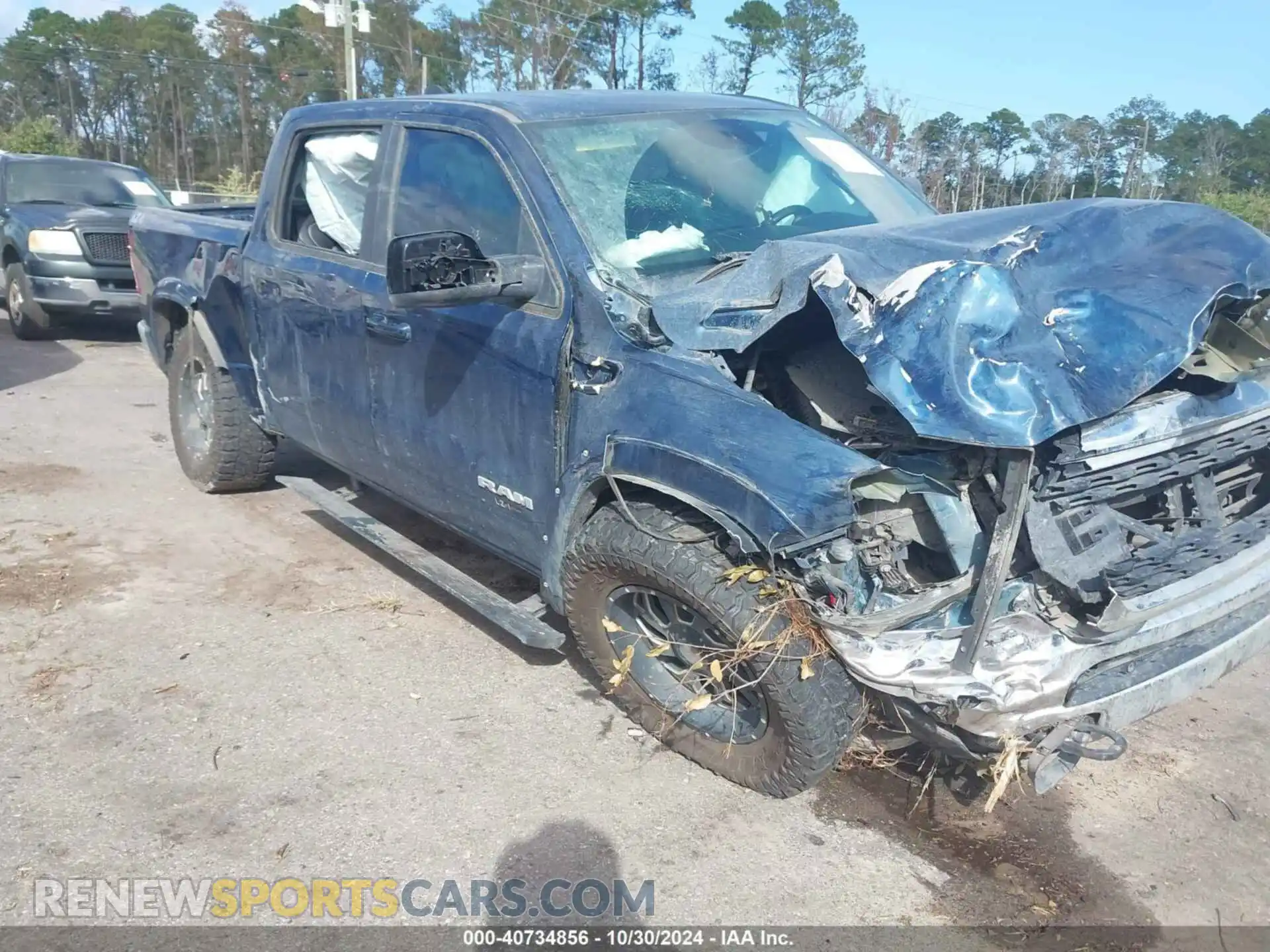 1 Photograph of a damaged car 1C6SRFFT6NN331072 RAM 1500 2022