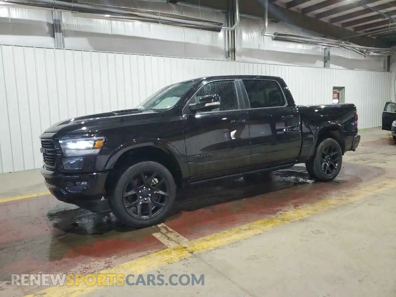 1 Photograph of a damaged car 1C6SRFJT1NN322576 RAM 1500 2022