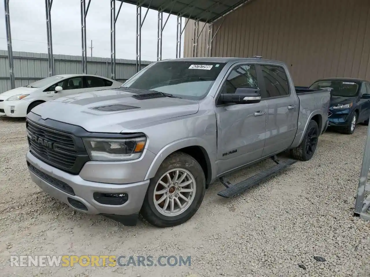 1 Photograph of a damaged car 1C6SRFJT4NN214193 RAM 1500 2022