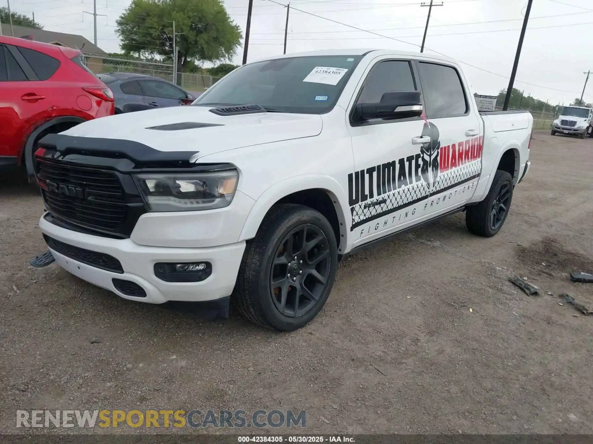 2 Photograph of a damaged car 1C6SRFJTXNN129844 RAM 1500 2022