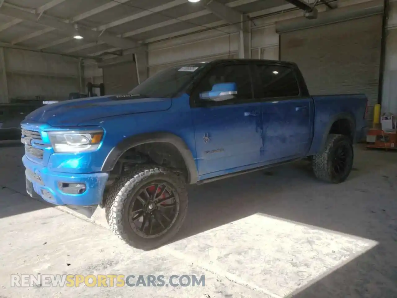 1 Photograph of a damaged car 1C6SRFJTXNN215428 RAM 1500 2022