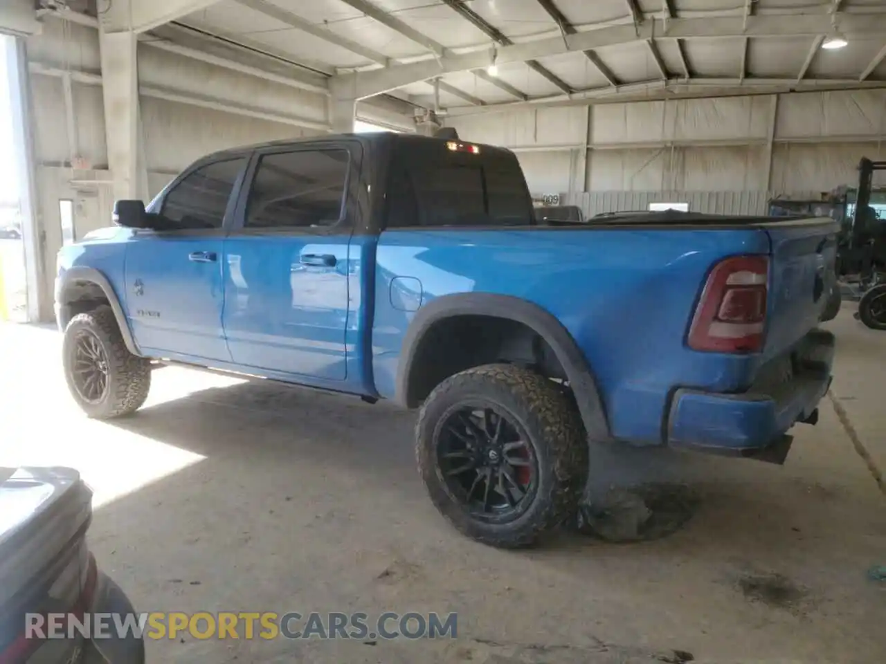 2 Photograph of a damaged car 1C6SRFJTXNN215428 RAM 1500 2022