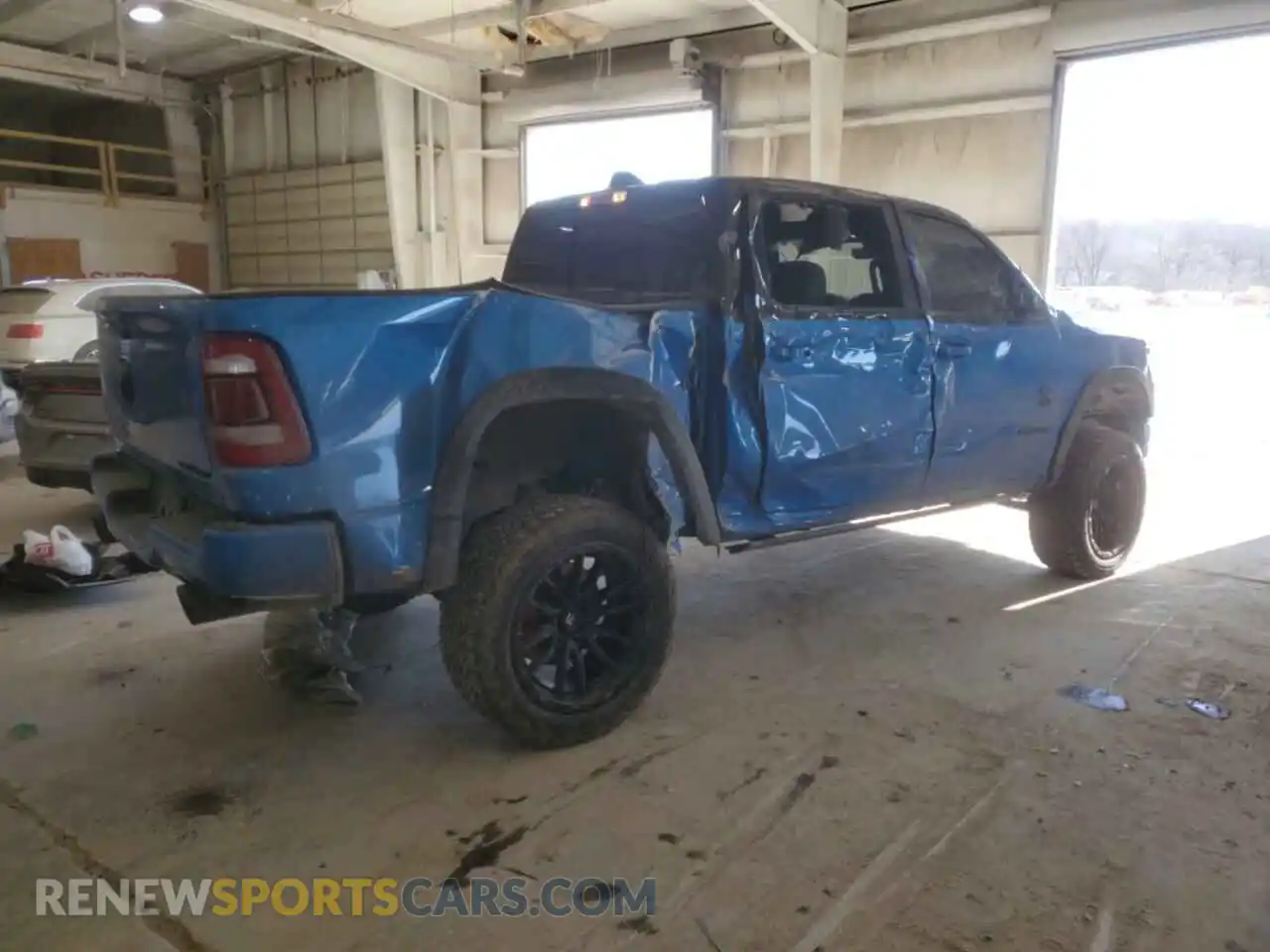 3 Photograph of a damaged car 1C6SRFJTXNN215428 RAM 1500 2022