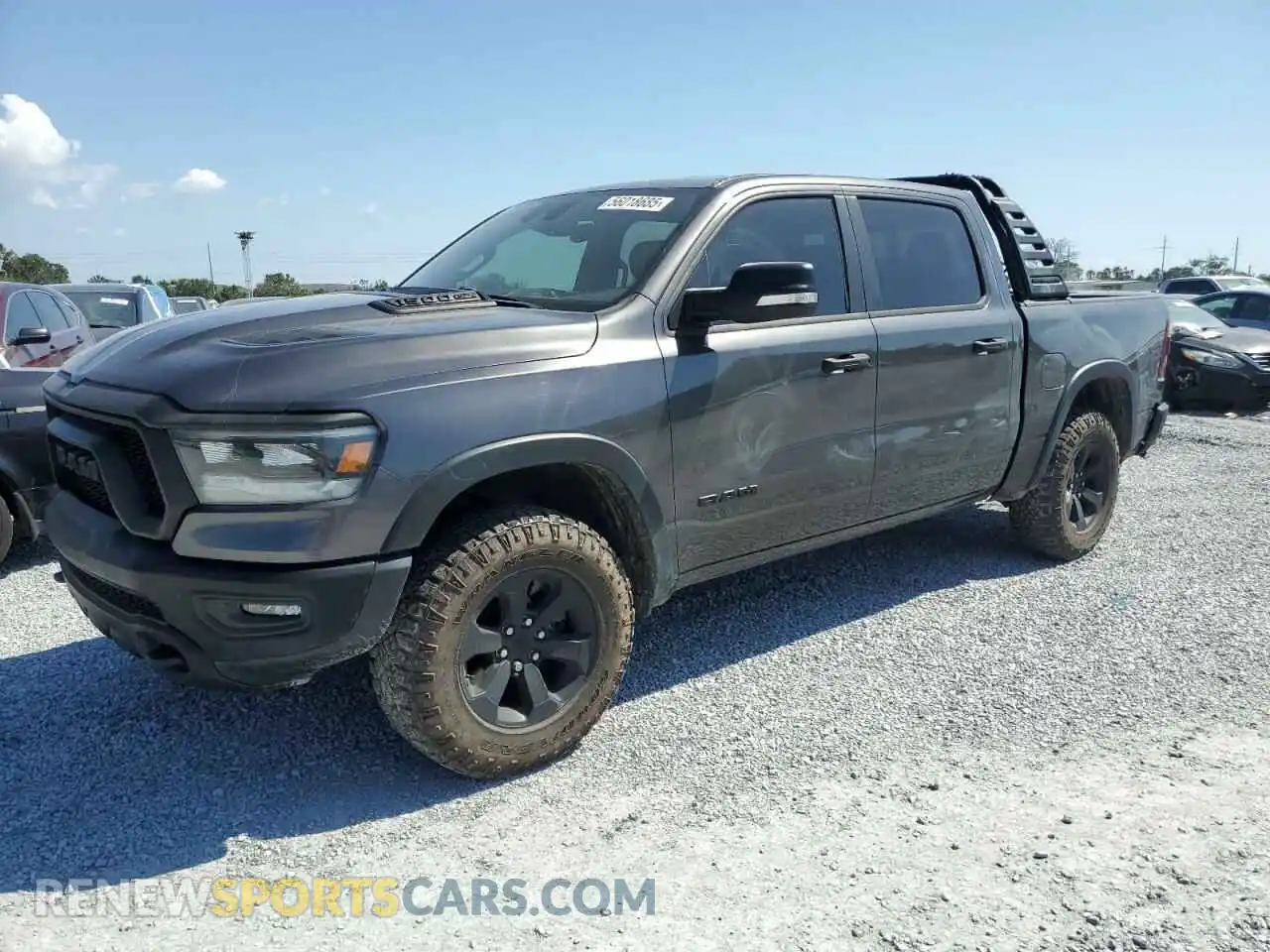 1 Photograph of a damaged car 1C6SRFLT1NN322669 RAM 1500 2022